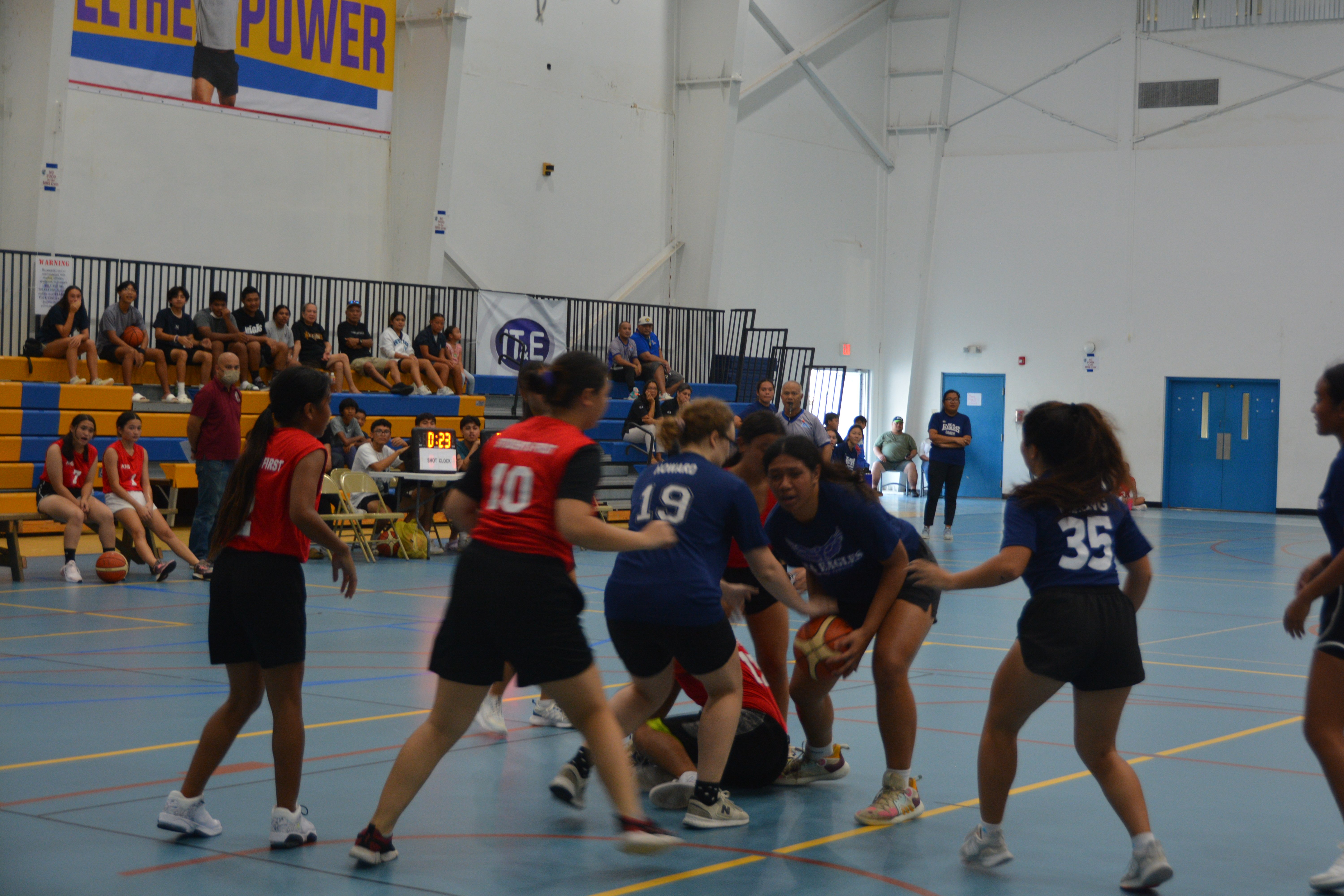 GCA's Azriel Fatialofa fights off defenders as she secures the loose ball during a high school girls division game of the ITE& Interscholastic Basketball League Monday at the MHS gym.