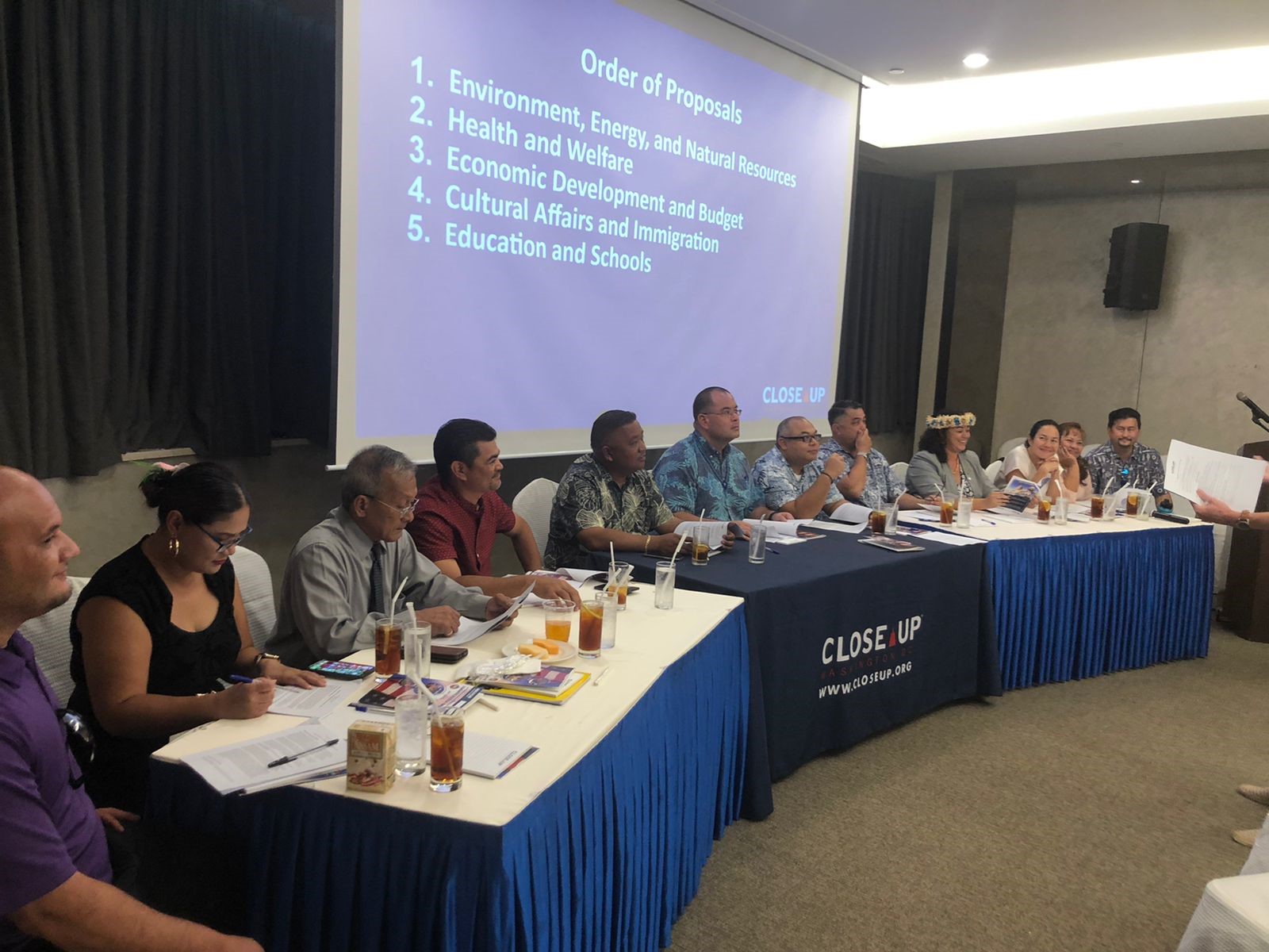 Members of the CNMI Legislature listen to proposals made by the students.