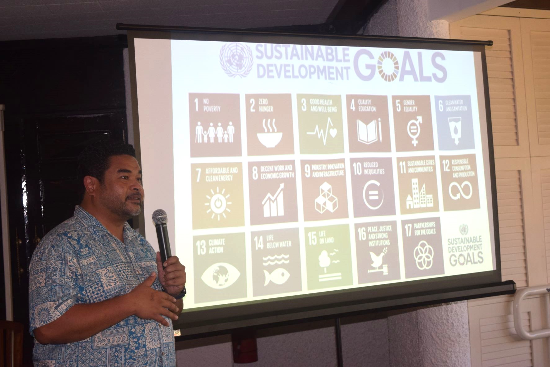 Office of Planning and Development Director Kodep Ogumoro-Uludong makes a PowerPoint presentation during the Rotary Club of Saipan's luncheon meeting at the Hyatt Regency Saipan's Giovanni's Restaurant on Tuesday.
