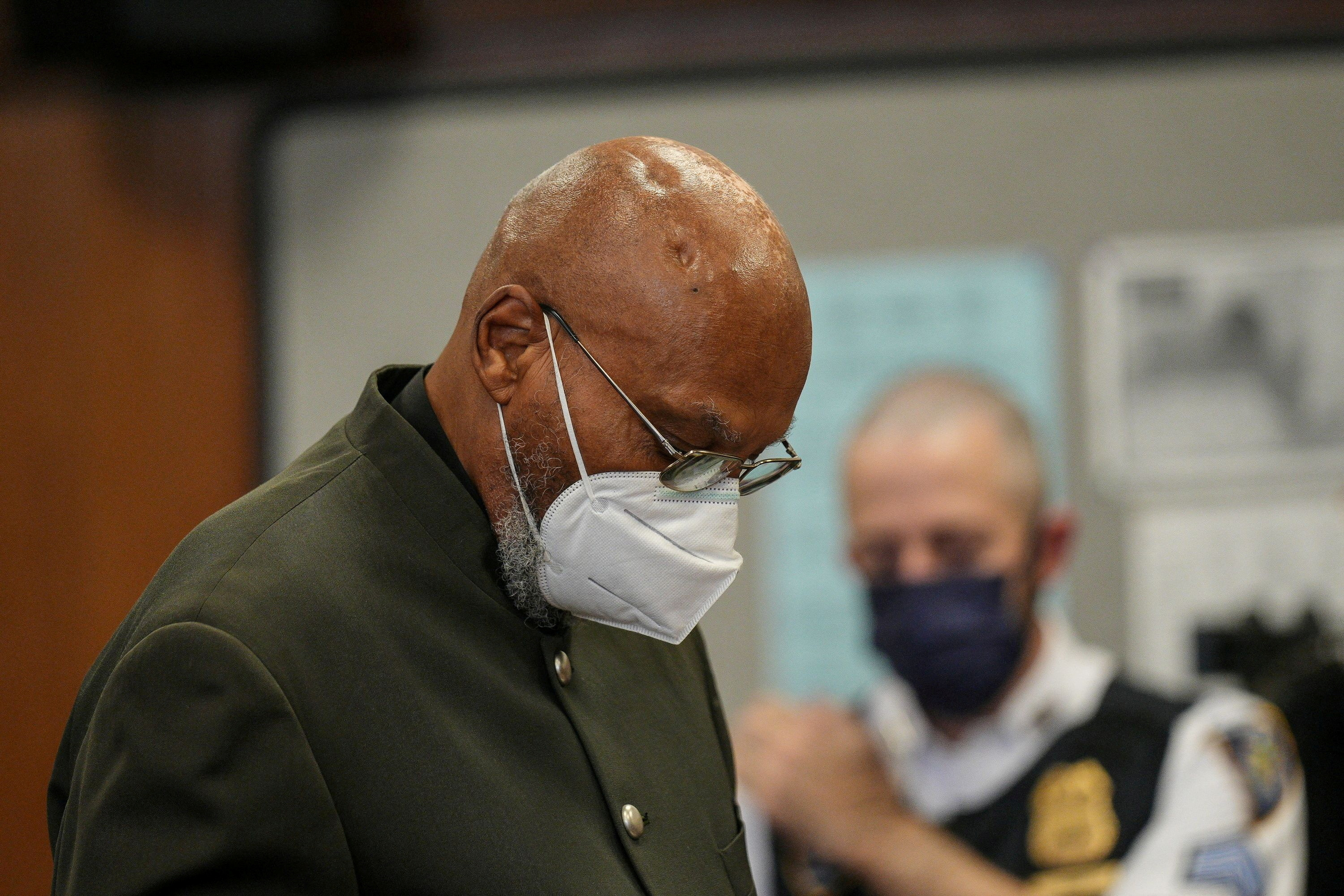 Muhammad Aziz, 83, one of the two men who spent decades in prison for murdering Black activist and civil rights advocate Malcolm X in 1965, looks down during his exoneration trial by a New York state judge at State Supreme Court in New York City, Nov. 18, 2021.