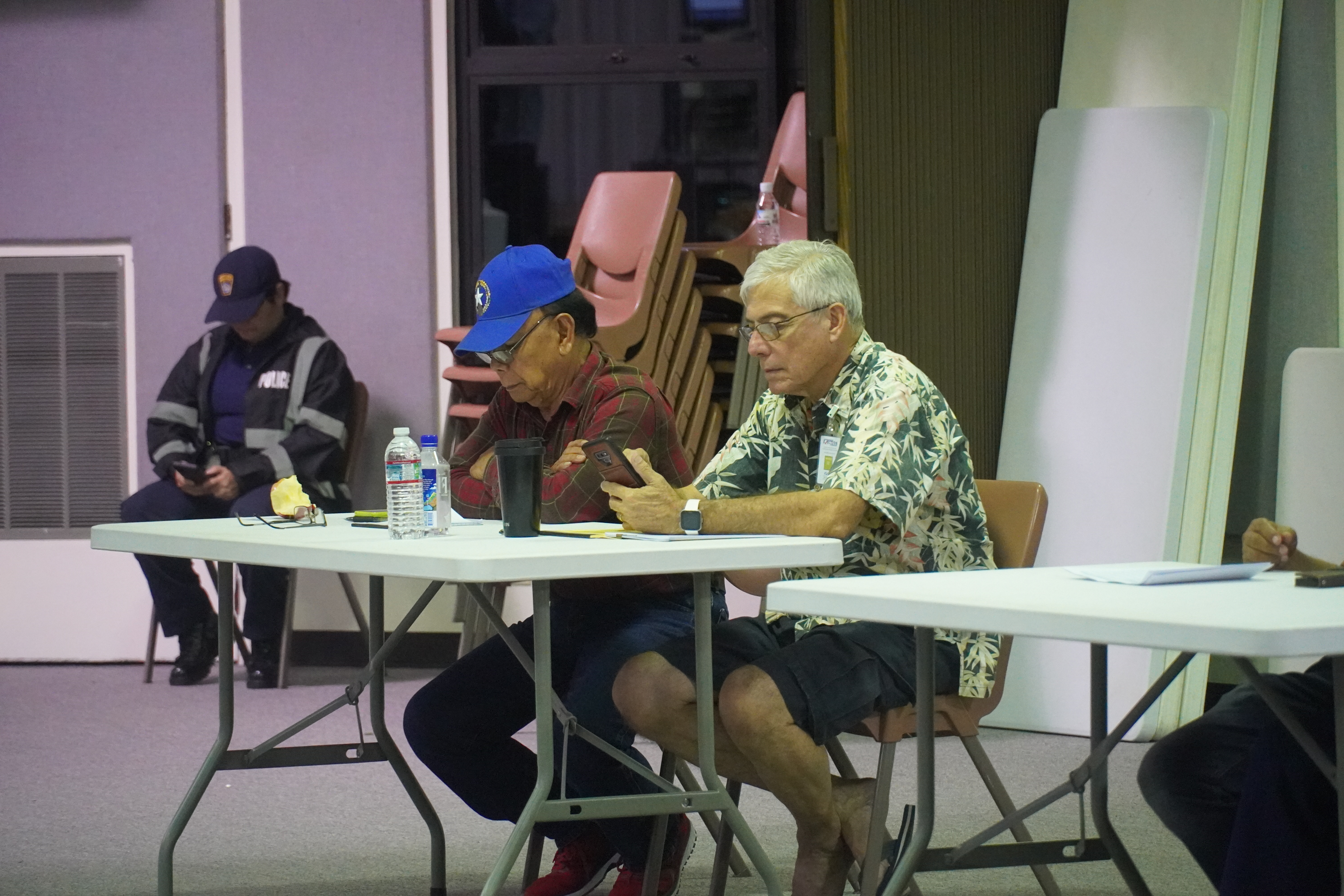 NMI Democratic Party poll observers Daniel Quitugua and Stephen Woodruff at the multi-purpose center on election night, Nov. 8, 2022.