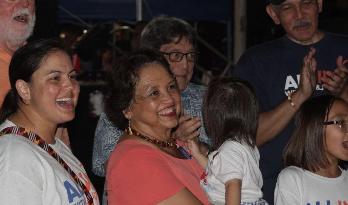 Guam Gov. Lou Leon Guerrero, center, smiles as family and supporters cheer while watching an announced set of results tabulated during the 2022 general election at her campaign headquarters early Wednesday morning.