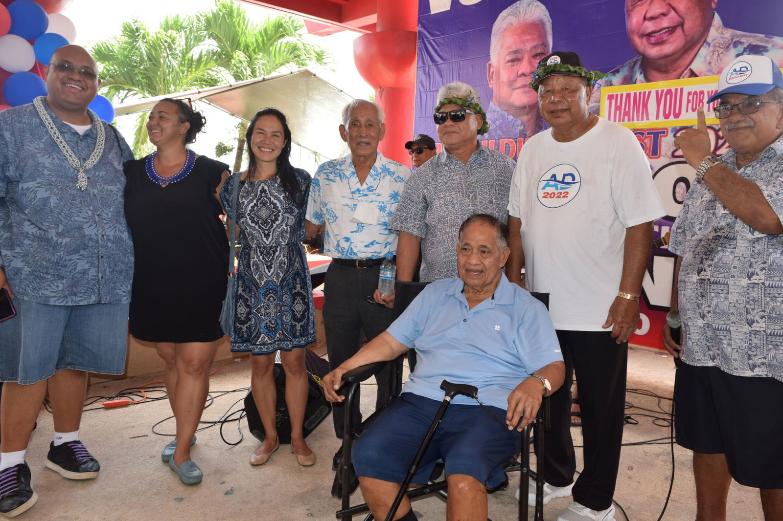 From left, NMI Democratic Party Chairman Jonathan P. Cabrera, Rep. Leila Staffler, Rep. Tina Sablan, former Gov. Carlos S. Camacho, Independent gubernatorial candidate  Lt. Gov. Arnold I. Palacios, his running mate Saipan Mayor David M. Apatang, and former  Speaker Oscar M. Babauta with former Gov. Benigno R. Fitial, seated, at the Minatchom Atdao Pavilion in Susupe following a motorcade on Saturday.