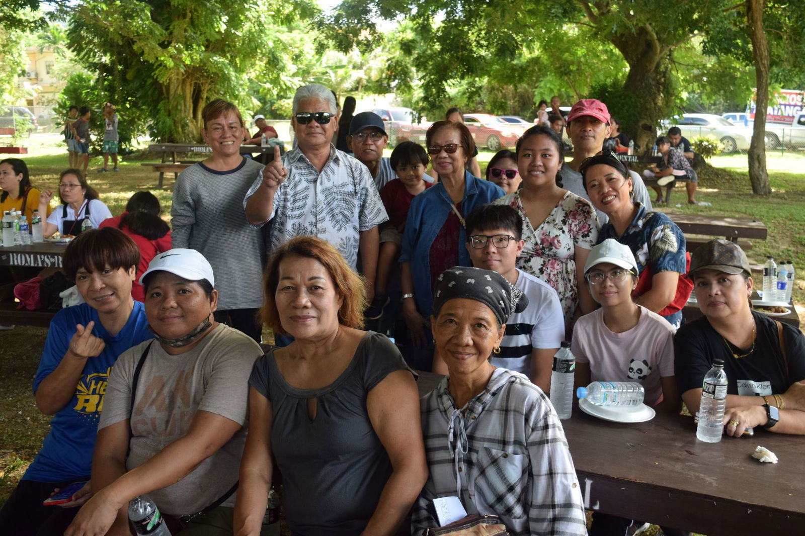Independent gubernatorial candidate Lt. Gov. Arnold I. Palacios poses with Filipino community members at  Sugar King Park in Garapan on Saturday.