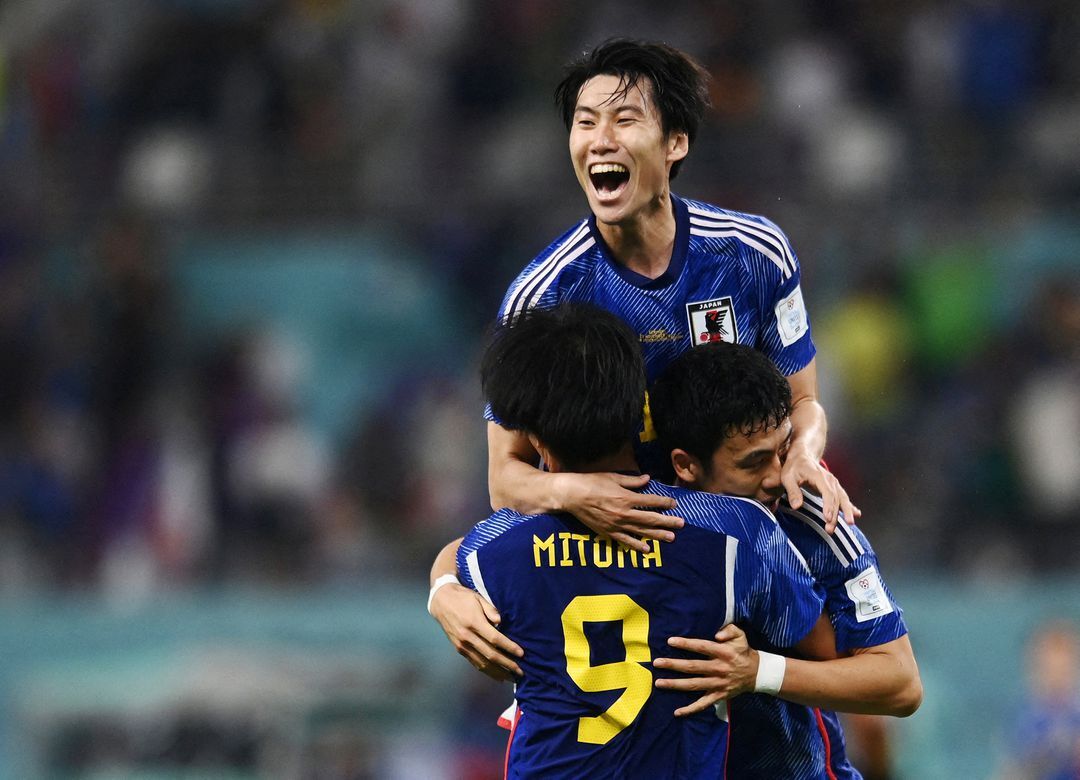 Japan's Kaoru Mitoma, Wataru Endo and Yuto Nagatomo celebrate after the match  at Khalifa International Stadium in Doha, Qatar on Nov. 23, 2022