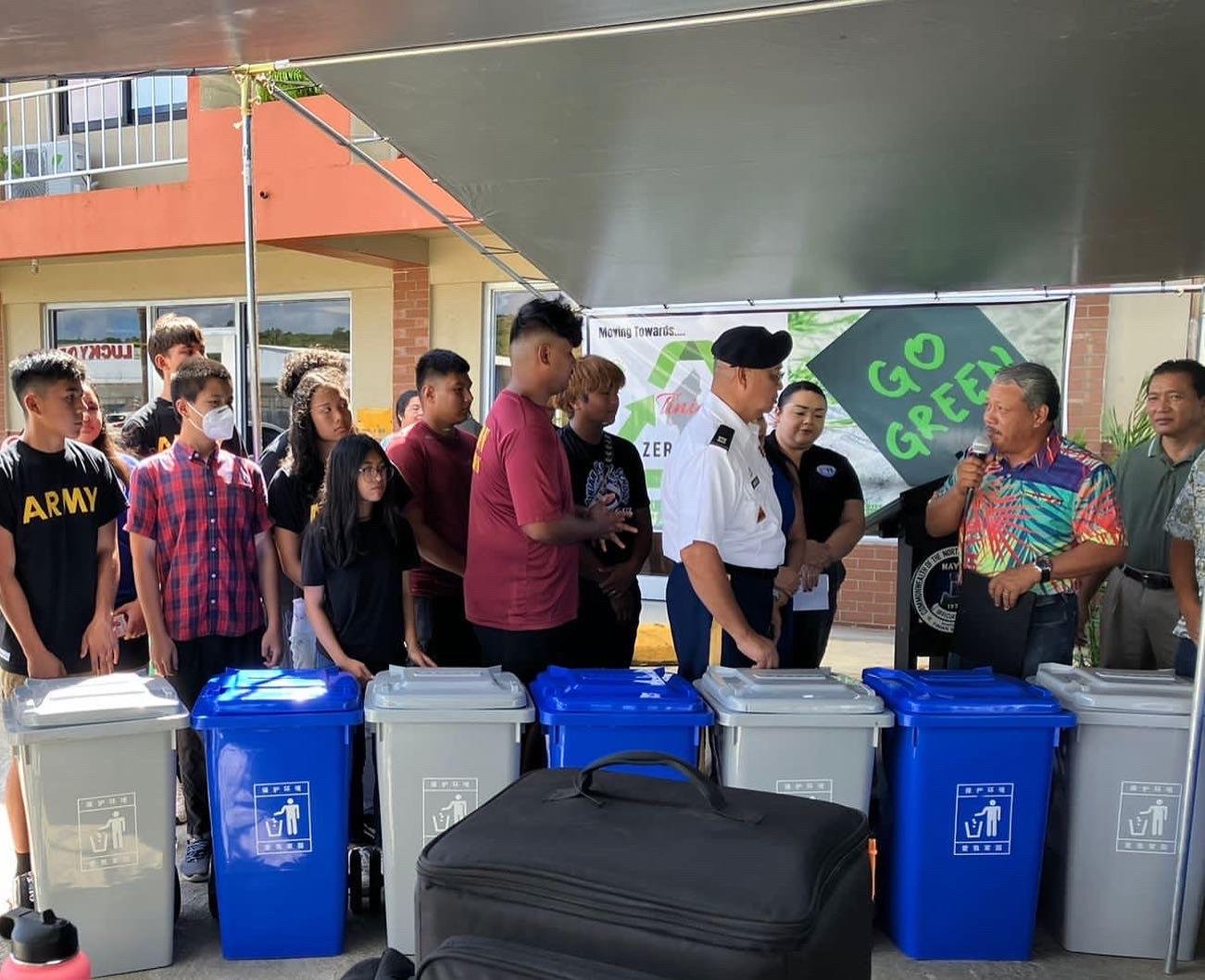 Tinian Mayor Edwin Aldan donates recycling bins to the JROTC cadets’ recycling project.