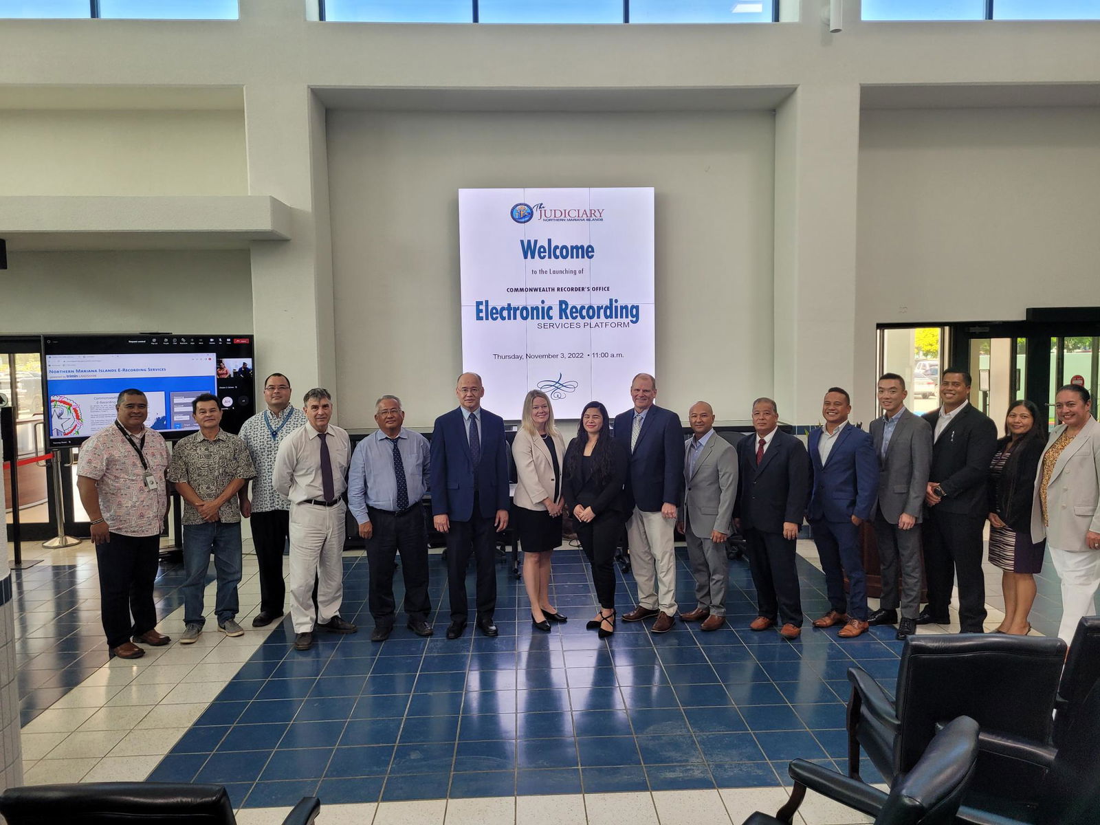 Commonwealth Recorder Kelsey G. Aldan, 8th left, with TriMin Systems President Dave Mackay, and Product Manager Erin Hultgren, CNMI judges and justices, other government officials and TurnKey Solutions executives pose for a photo during the launching ceremony for the judiciary’s electronic recording platform services on Nov. 3, 2022 at the Guma Hustisia in Susupe.