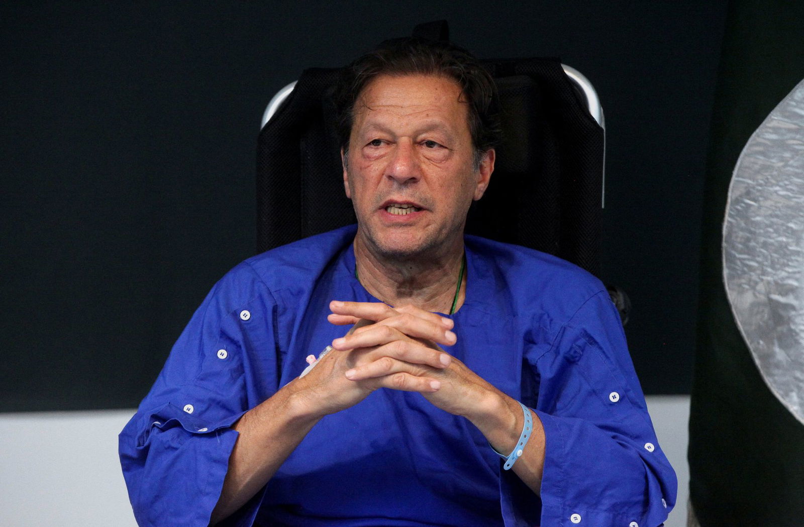 Former Pakistan's Prime Minister Imran Khan addresses a news conference after he was wounded following a shooting incident during a long march in Wazirabad, at the Shaukat Khanum Memorial Cancer Hospital & Research Centre in Lahore, Pakistan on Nov. 4, 2022.