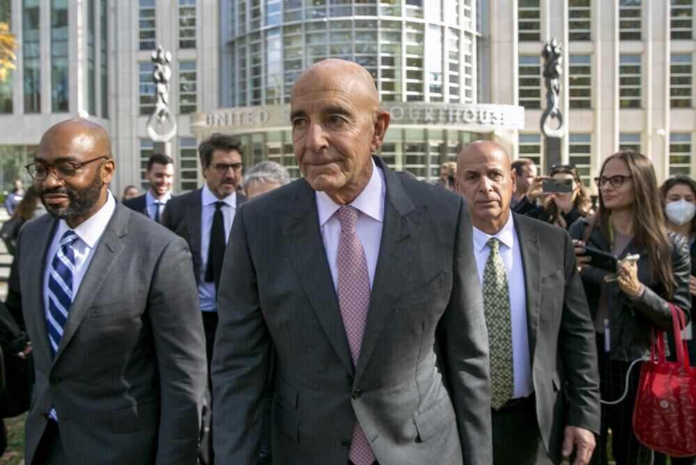 Tom Barrack, center, leaves Brooklyn Federal Court, Friday, Nov. 4, 2022, in New York.