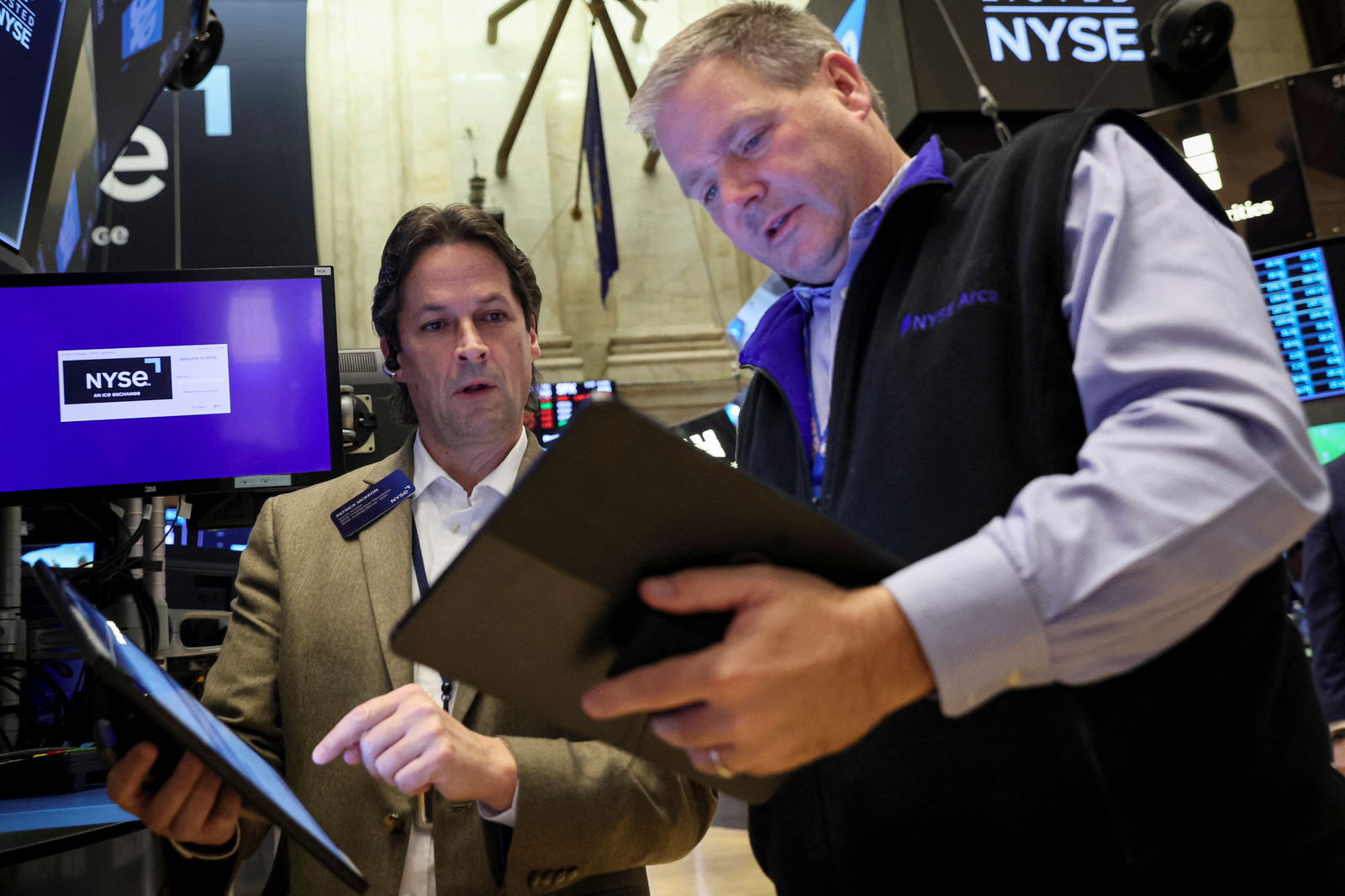 Traders work on the floor of the New York Stock Exchange in New York City, Nov. 21, 2022.