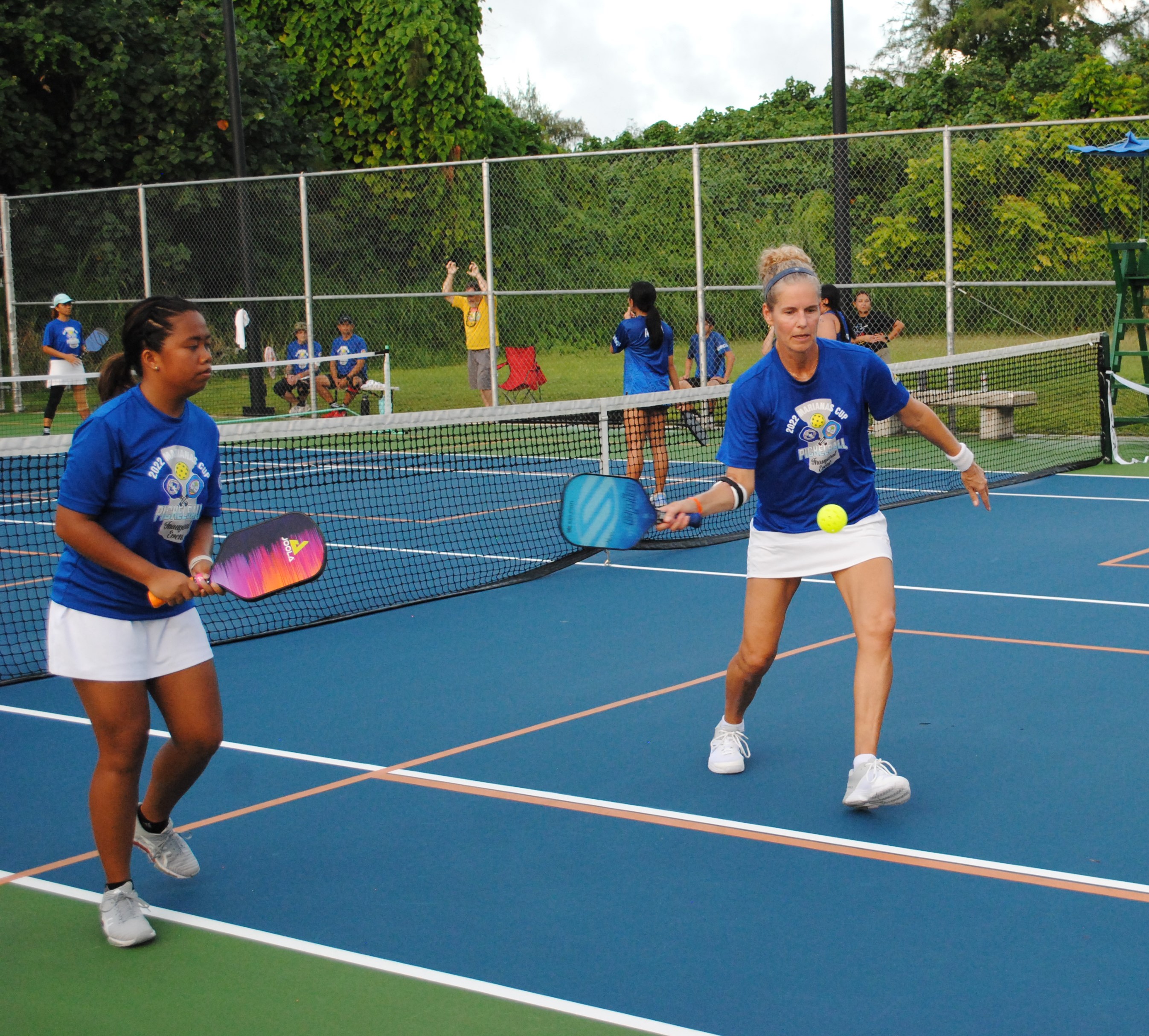 Team Saipan's Karen Klassen extends for the return alongside teammate Chelsea Henzon during the inaugural Marianas Cup Pickleball Tournament at American Memorial Park on Saturday.