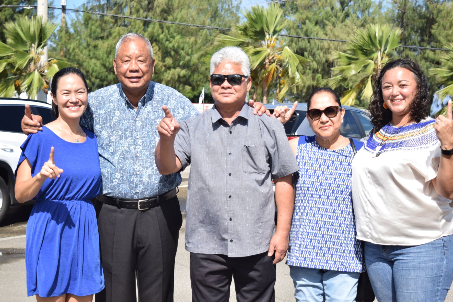 From left Rep. Tina Sablan, Saipan Mayor David M. Apatang, Lt. Gov. Arnold I. Palacios, his wife Wella, and Rep. Leila Staffler flash the “No. 1” sign before casting  their ballots Thursday at the multi-purpose center. The Independent gubernatorial ticket of Palacios and Apatang are number one on the runoff ballot.