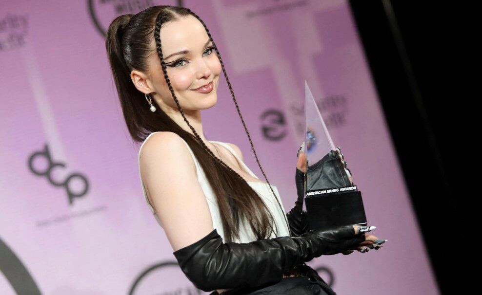Dove Cameron, winner of the New Artist of the Year award, poses in the press room during the 2022 American Music Awards at the Microsoft Theater in Los Angeles, California, Nov. 20, 2022.