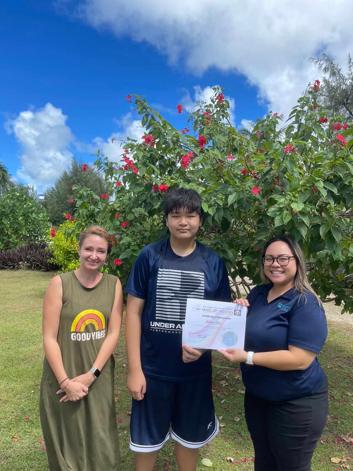 Saipan Community School's Daniel Nae bagged the Pacifica Art Contest 3-Dimensional Category.  He received his award and cash prize from Pacifica Insurance's Dionne Camacho.  Also in the photo is SCS principal Amanda Dunn.