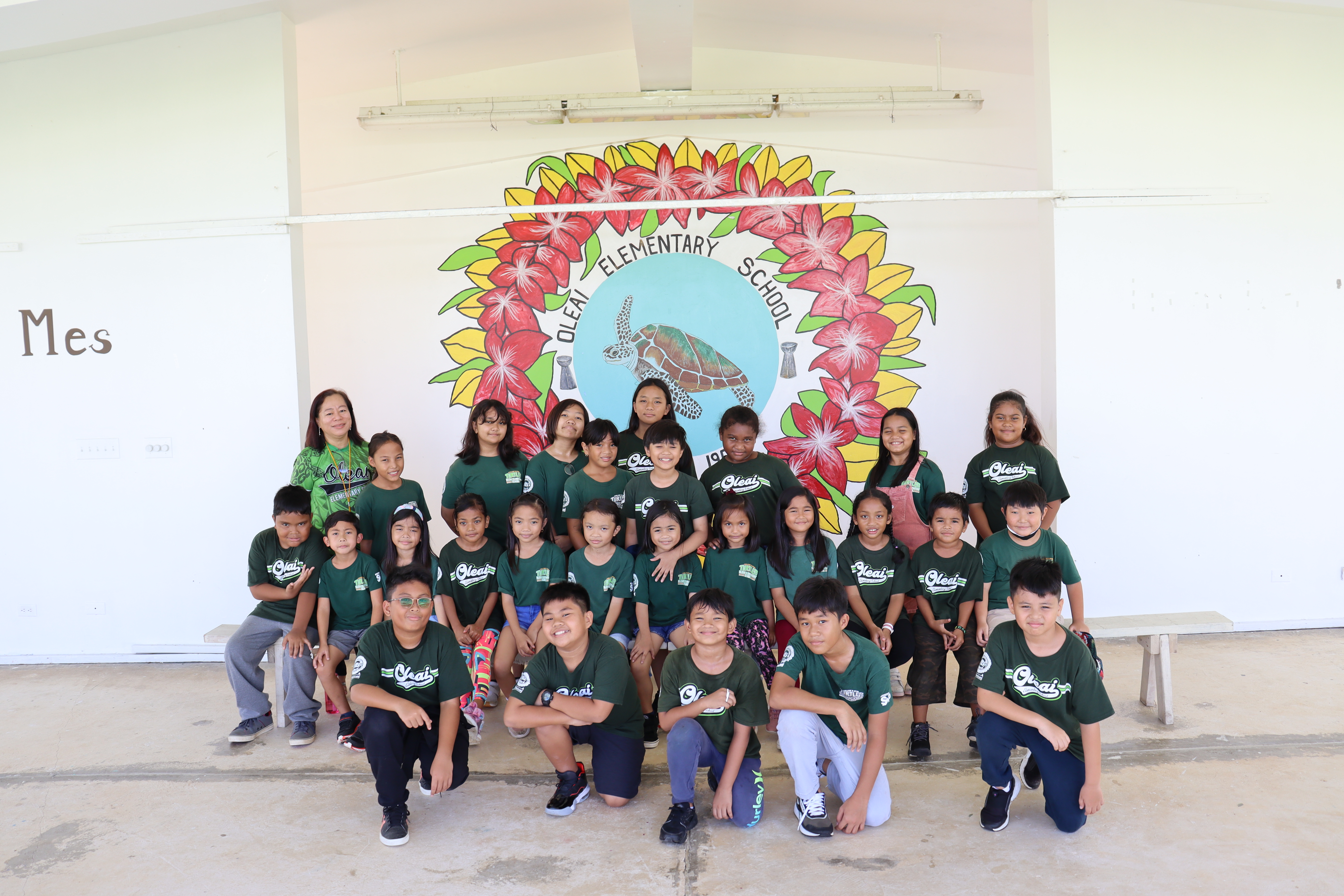 The OES PGFC participants pose for a photo on their campus in San Jose, Saipan.