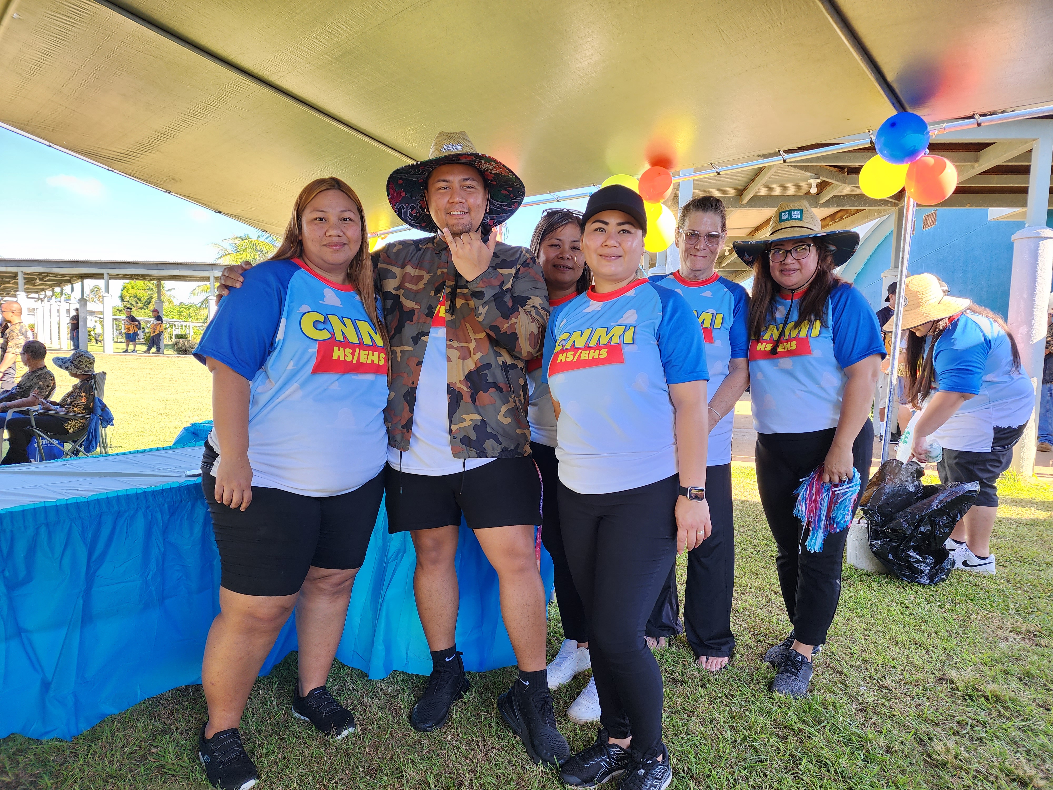 Head Start and Early Head Start personnel led by Director Lathania Angui, left, pose for a photo.