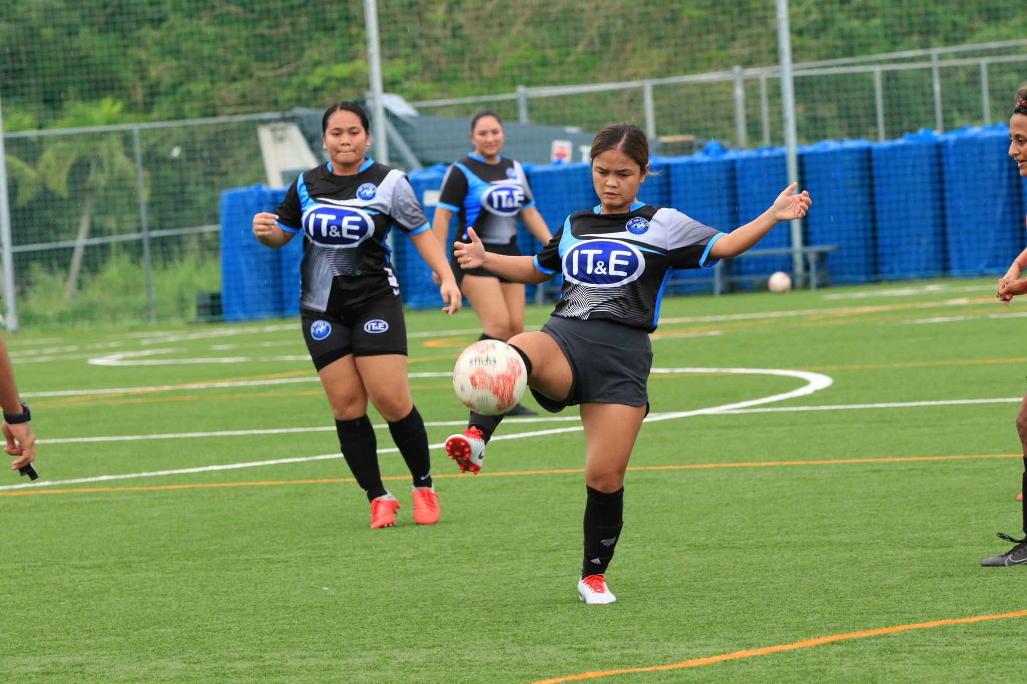 MP United's Laarni Zapanta reaches out to control the possession during a game against the Paire Football Club in the Intermediate “A” Division of the Dove Women's League at the NMI Soccer Training Center.