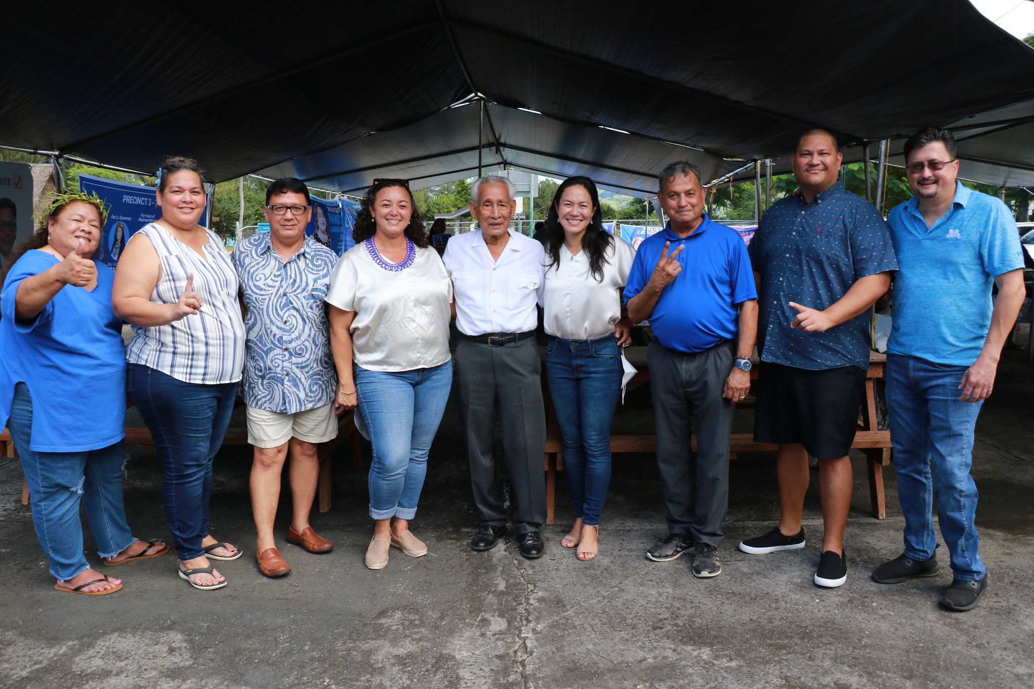 NMI Democratic gubernatorial candidate Rep. Tina Sablan, fourth right, and her running mate, Rep. Leila Staffler, fourth left, pose for a photo with the CNMI's first governor, Dr. Carlos S. Camacho, center, Saipan mayoral candidate Rep. Richard Lizama, third right, Precinct 3 candidates, from left, Rep. Denita Yangetmai and Lauren Yvonne Pangelinan, Precinct 5 candidate Peter Francis R. Muna, and Precinct 1 candidates Diego Vincent Camacho and Rep. Edwin Propst in the Civic Center area on Friday.