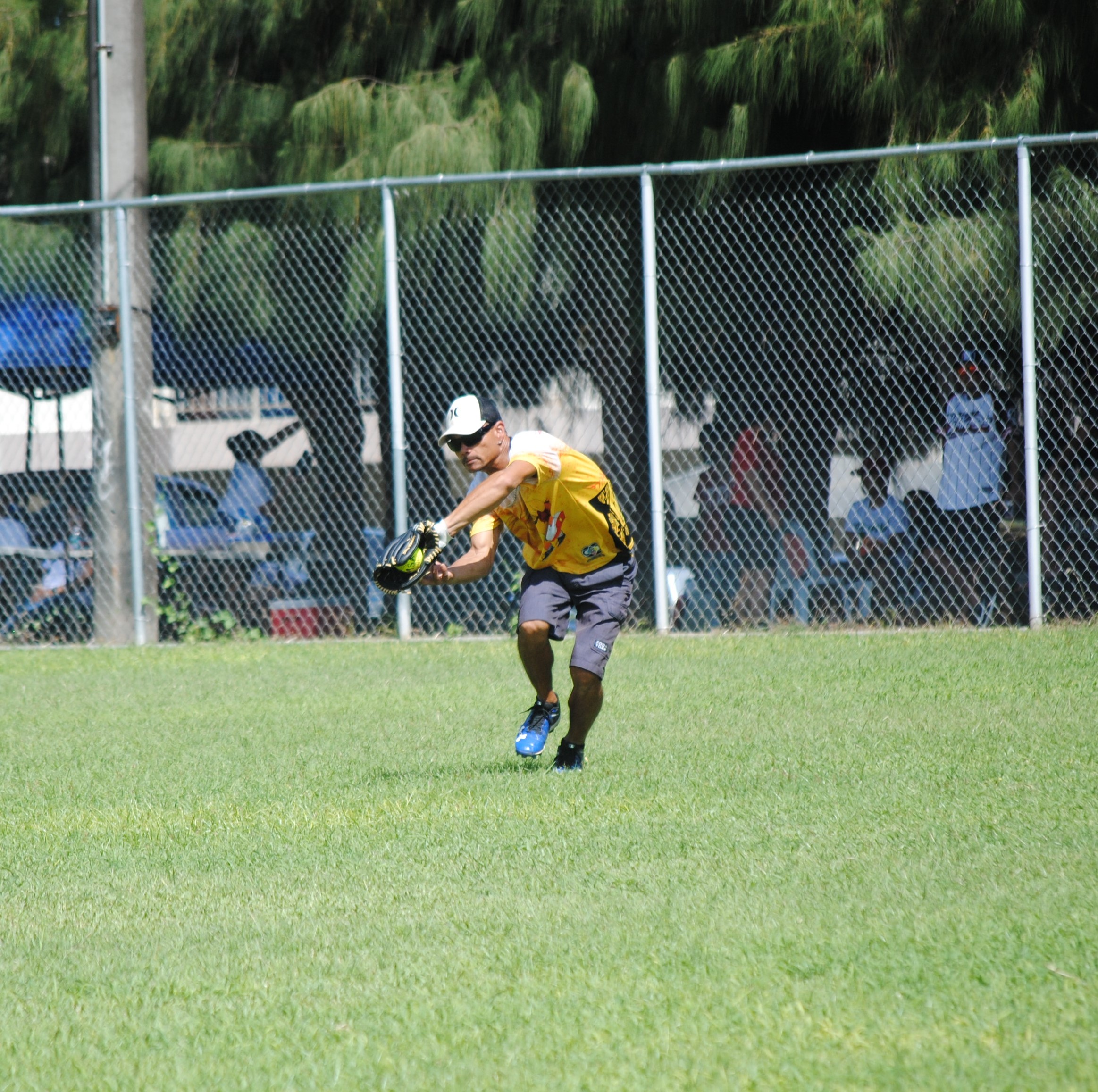 Hagu Lamun centerfielder Richard Quitugua catches the flyball for the out during a 2022 Budweiser Belau Amateur Softball League game Sunday at the Dandan baseball field.