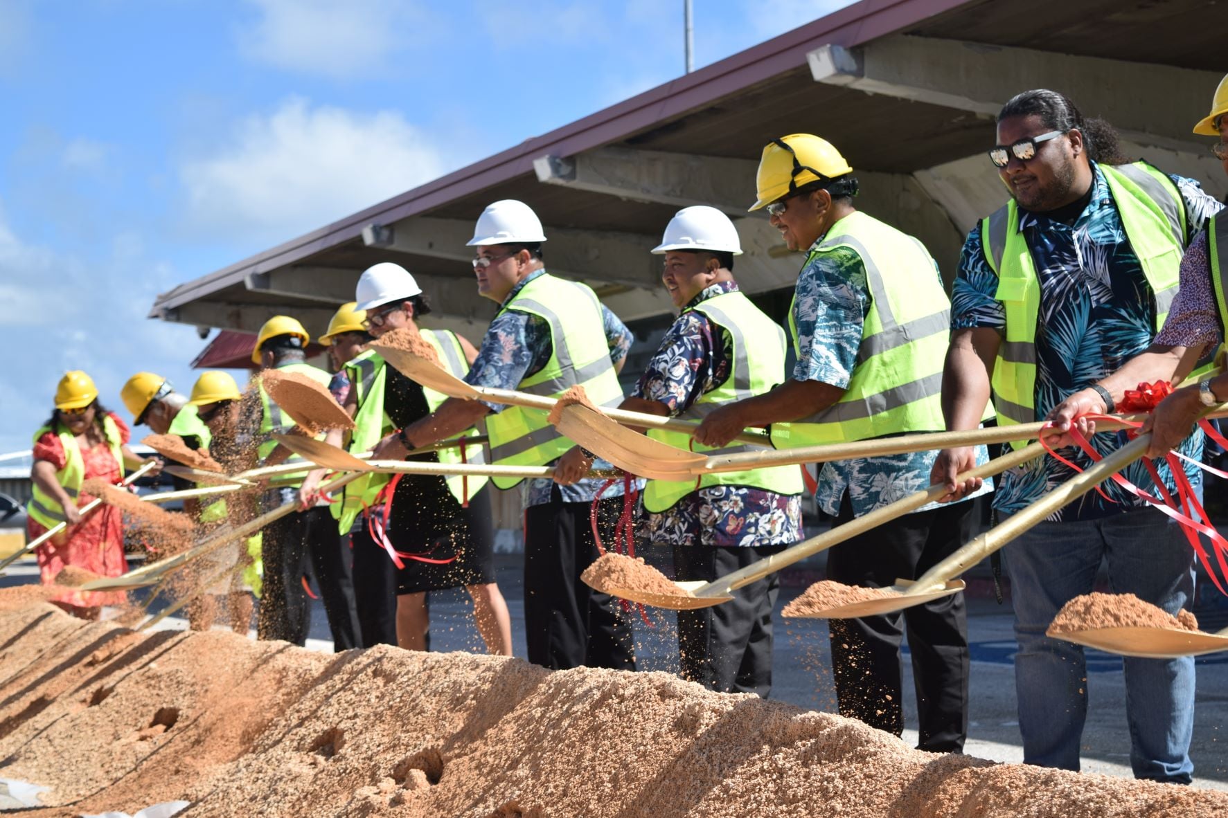 Gov. Ralph DLG Torres, third right, Commonwealth Ports Authority Chairwoman Kimberlyn King-Hinds, sixth left, Speaker Edmund S. Villagomez, center, Senate President Jude U. Hofschneider, second right, and Sen. Karl King Nabors, right, use shovels during the groundbreaking ceremony for the commuter terminal construction project at the Francisco C. Ada/Saipan International Airport on Monday. Also in photo are Rep. Denita Yangetmai, CPA board vice chairman Roman Tudela, board members Pete P. Reyes and Joseph Diaz.