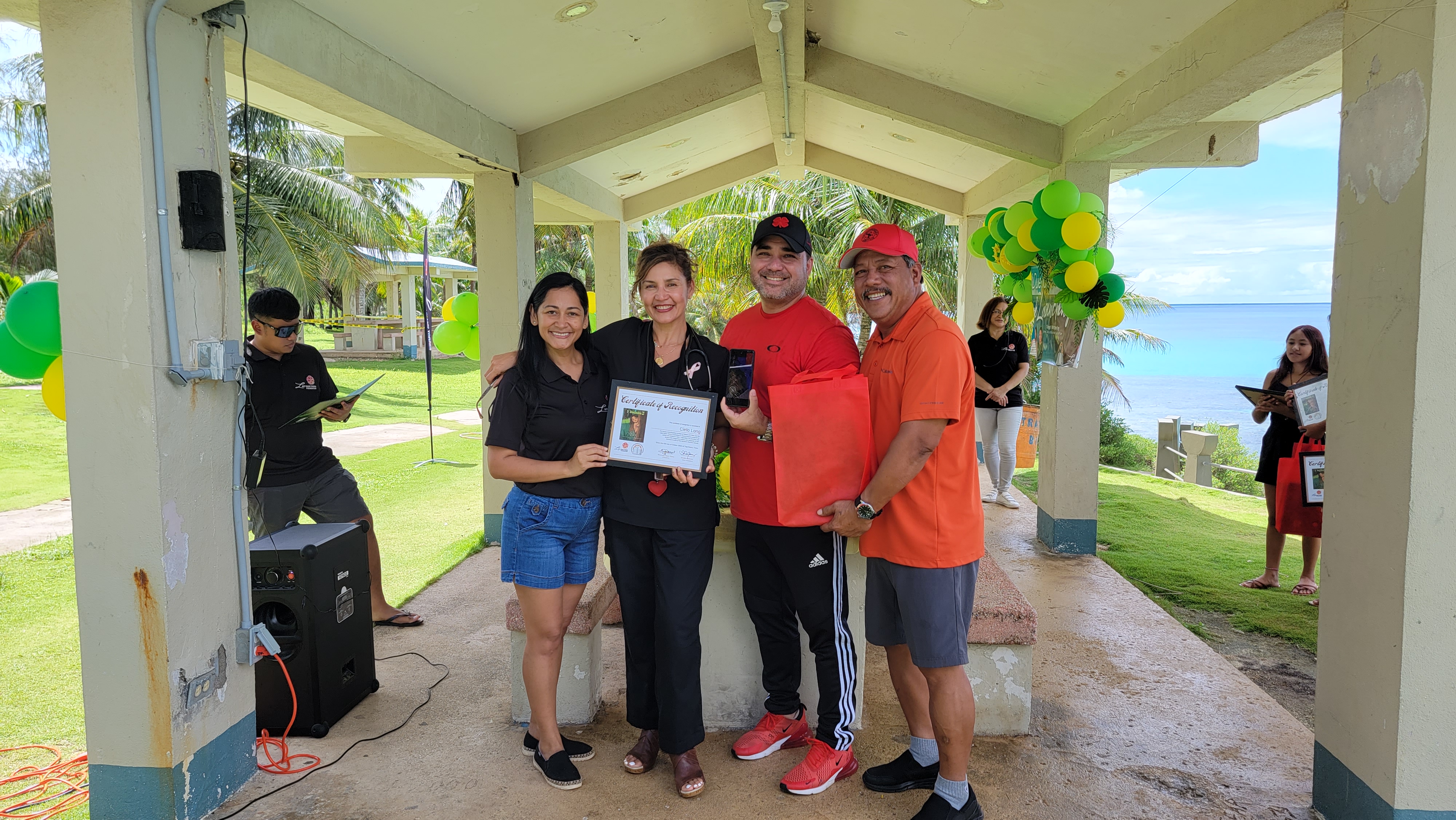 In her absence,I Duendis 2 Cielo Long's parents received her certificate of recognition from first lady Diann Torres. Also in photo is Tinian Mayor Edwin Aldan.