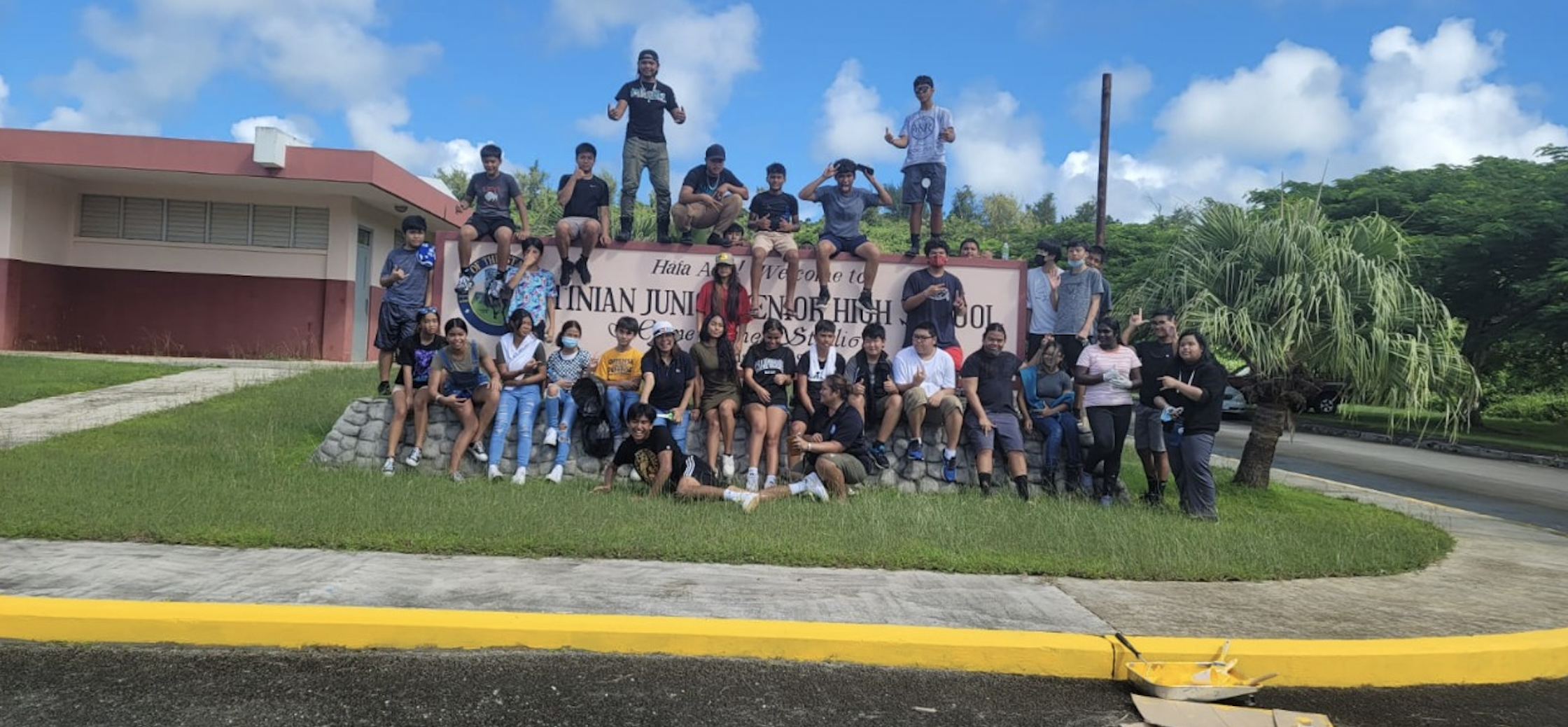 Tinian Jr./Sr. High School students pose for a photo during a campus beautification activity.