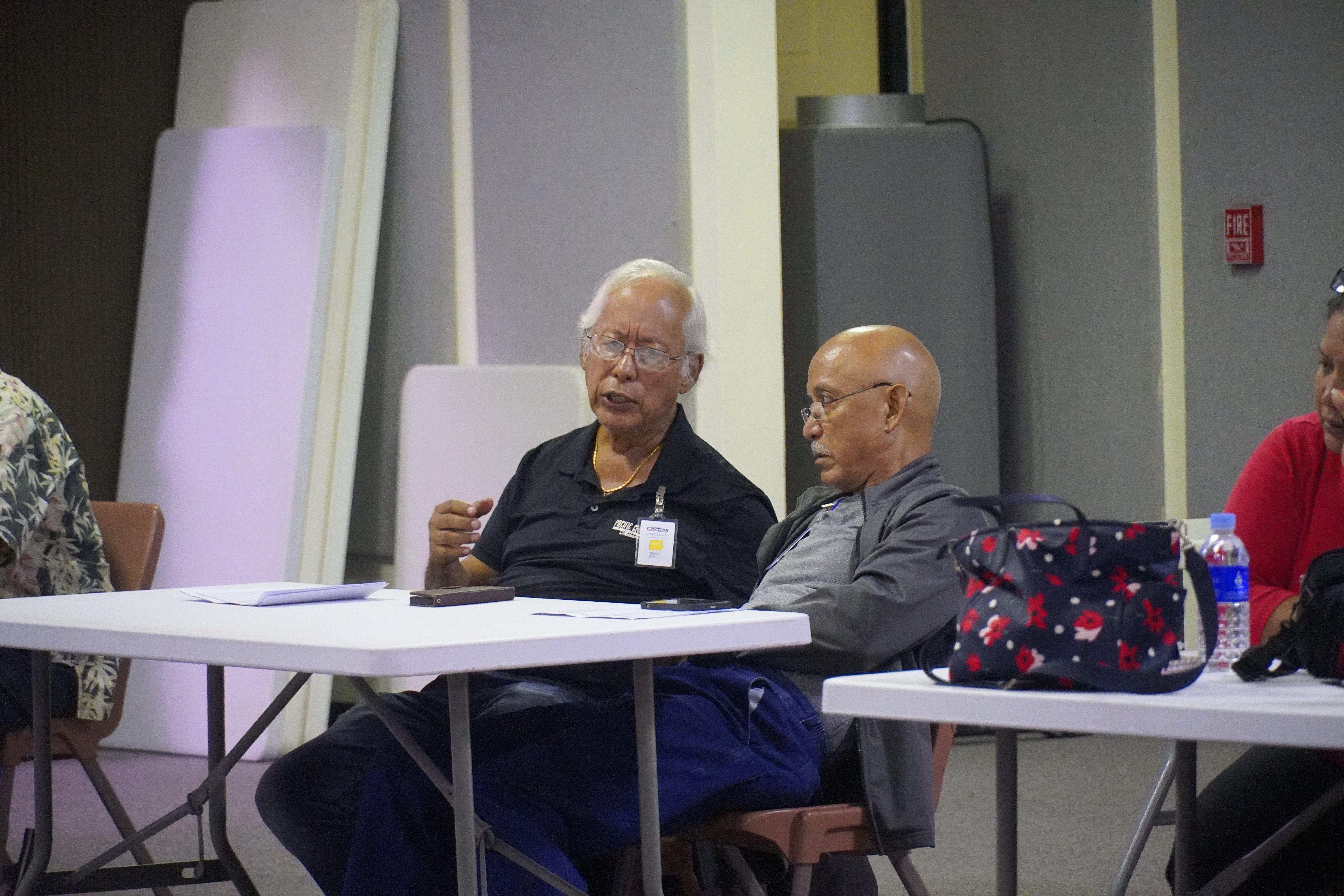 Independent poll observers Pete P. Reyes and Joe Pangelinan at the multi-purpose center on election night, Nov. 8, 2022.