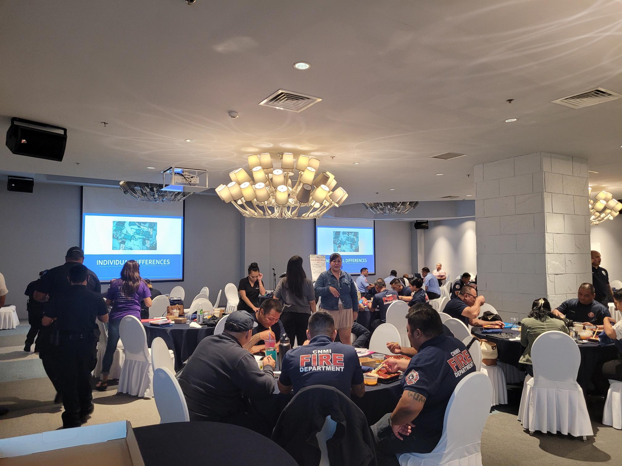 Frontliners take a break from a trauma informed-care training session at Kensington Hotel on Oct. 27.