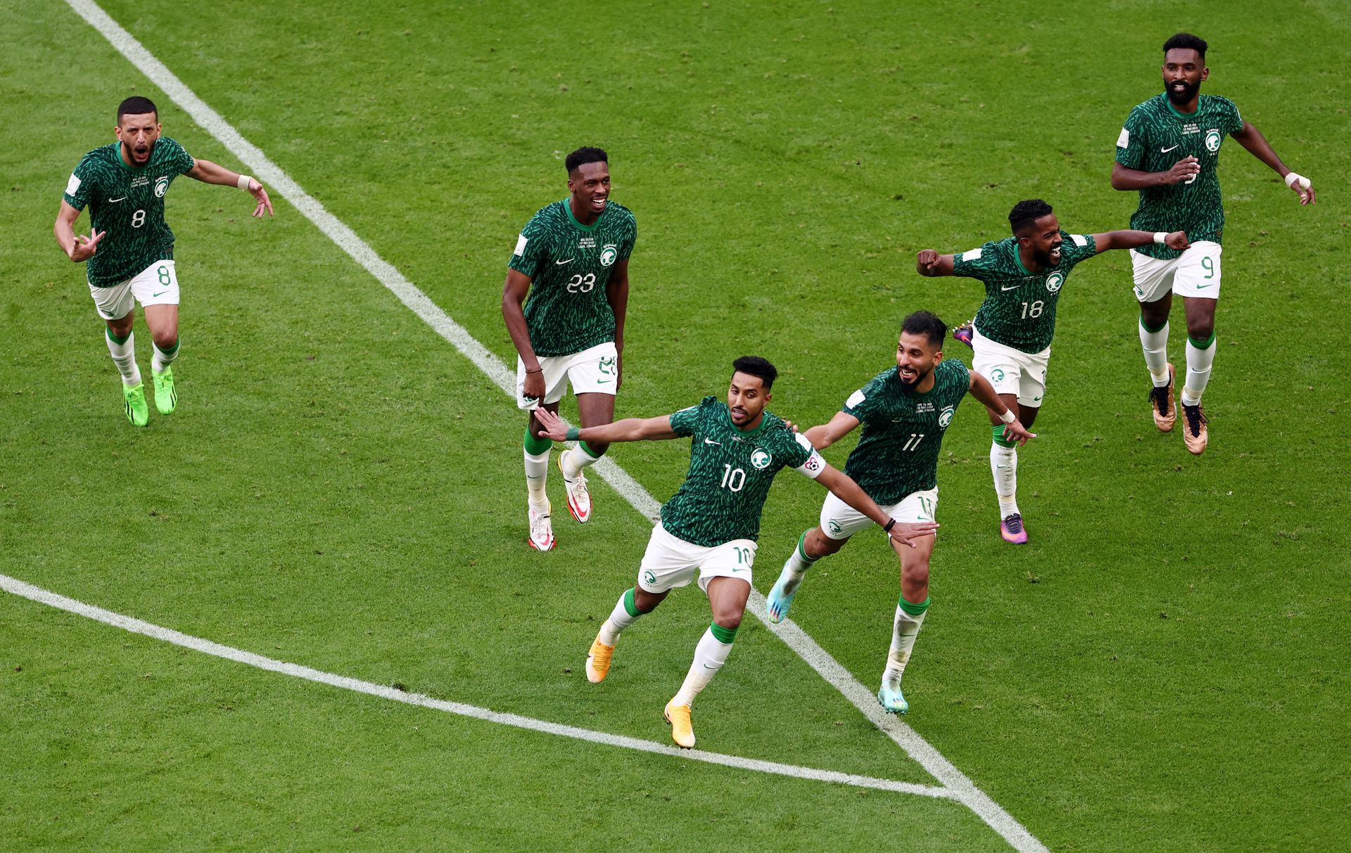 Saudi Arabia's Salem Al-Dawsari celebrates scoring their second goal with teammates at the Lusail Stadium in Lusail, Qatar on Nov. 22, 2022.