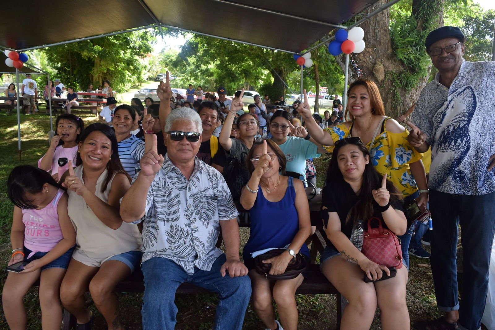 Independent gubernatorial candidate Lt. Gov. Arnold I. Palacios poses with Filipino and other community members at Sugar King Park in Garapan on Saturday.