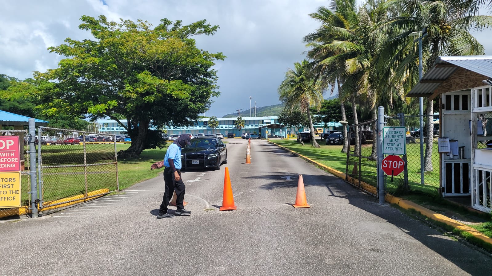 A police car is seen near the entrance to Marianas High School on Friday morning.