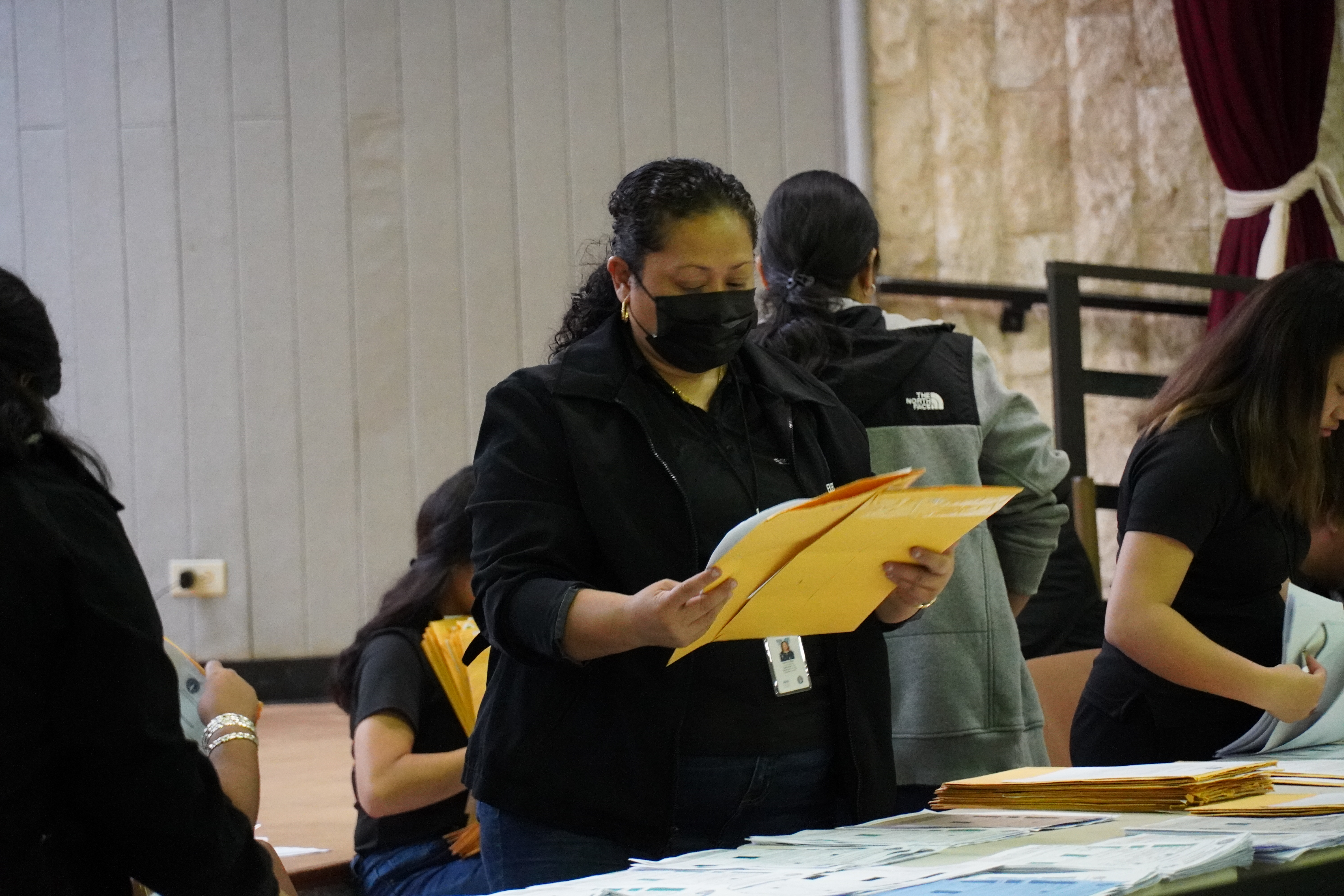 Commonwealth Election Commission Executive Director Kayla S. Igitol sorts runoff ballots.