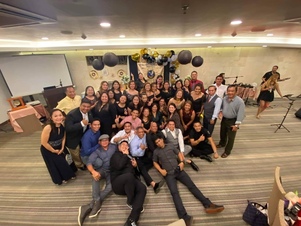 Magalahi  Eagles Club members pose for a photo with the Maga'Haga Lady Eagles.