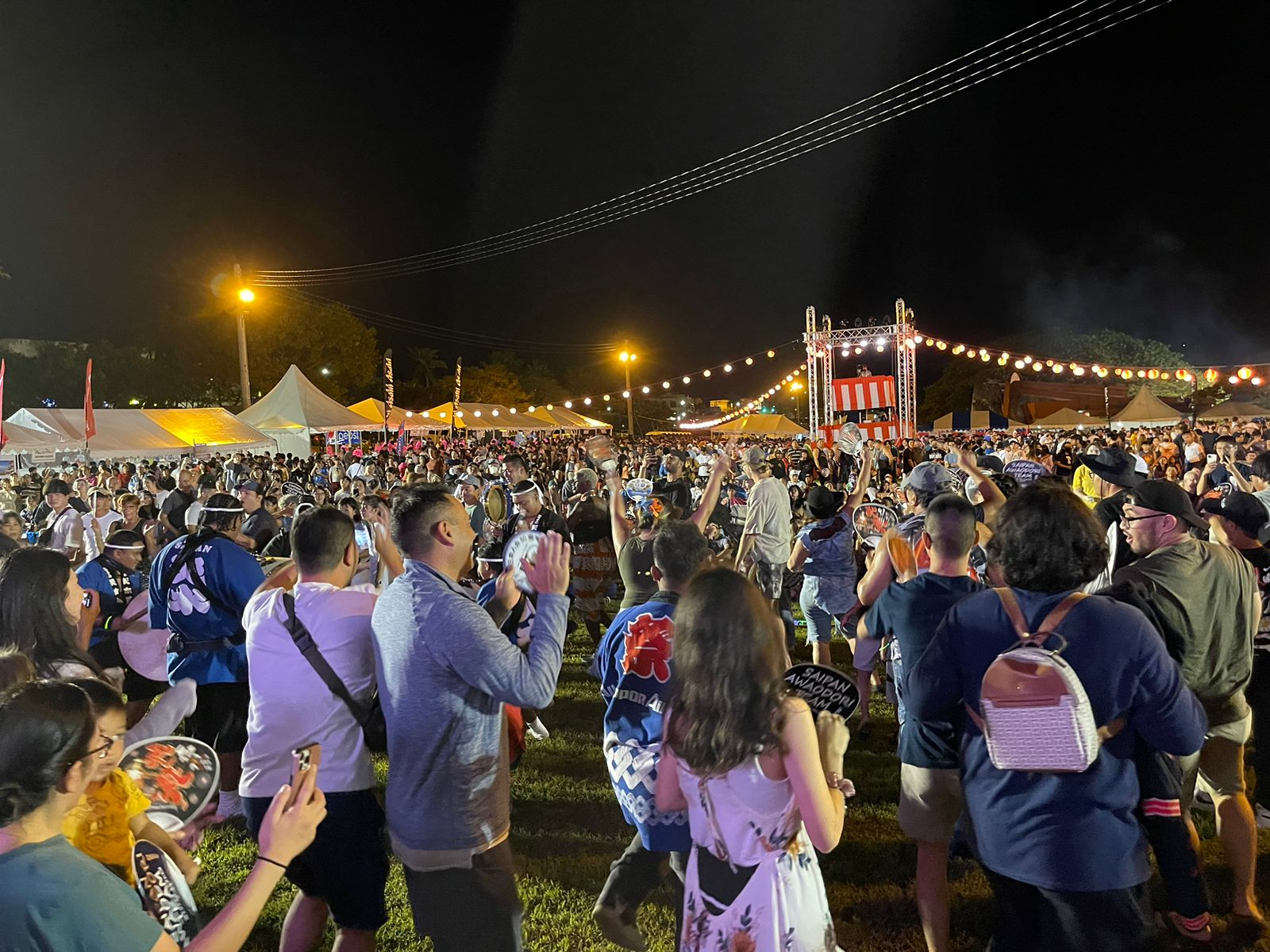 Members of the audience dance with the Saipan Awaodori Team during the 41st Japan Autumn Festival at Ypao Beach Park on Guam, Nov. 19, 2022.