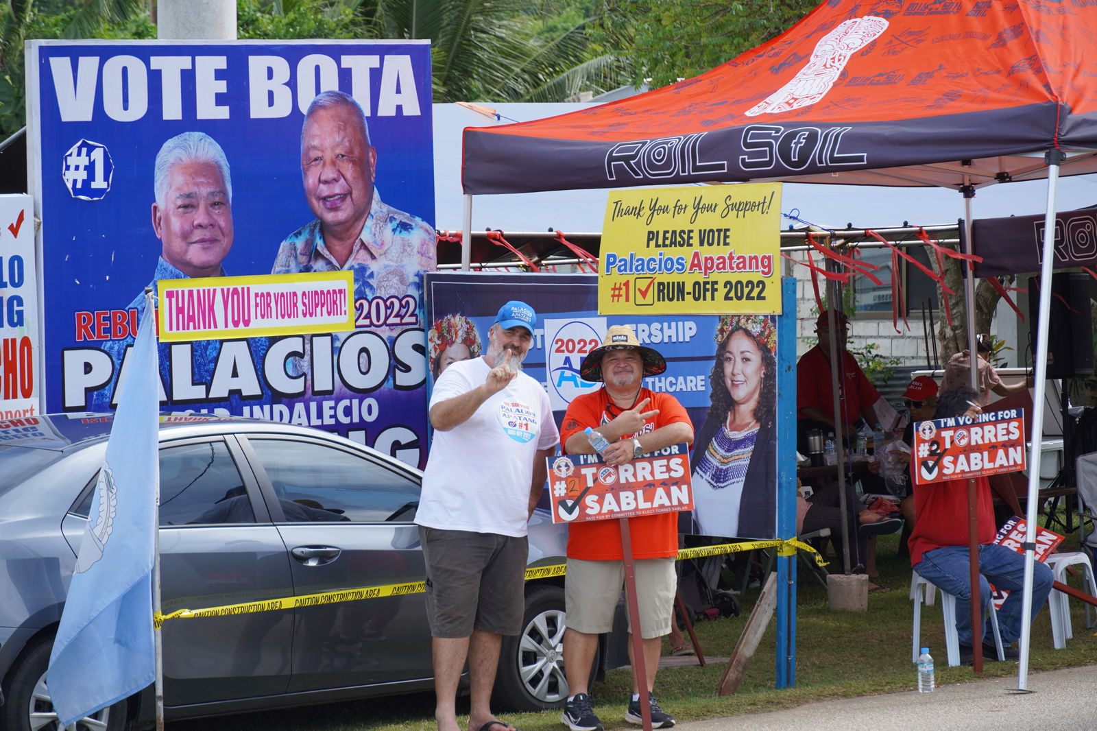 One Marianas. Supporters of the two opposing camps pose for a photo in Kagman.