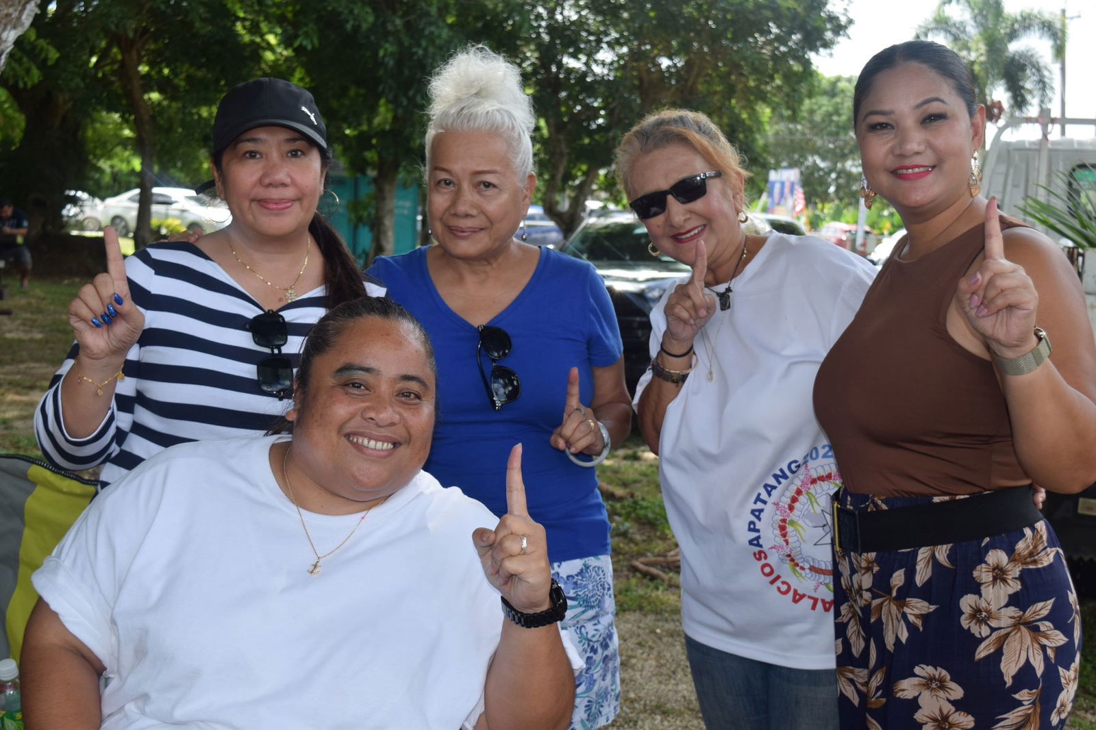 Senator-elect Corina Magofna, right, and Saipan Mayor's Office field operations director Joann Aquino, left, with other AD 2022 supporters.