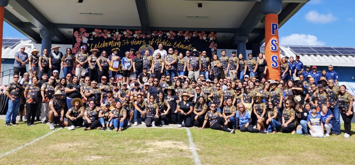 The Public School System and Board of Education Central Office personnel pose for a photo with education officials: Board of Education Chairman Gregory Pat Borja, Vice Chairman Antonio L. Borja, Secretart/Treasurer Maisie B. Tenorio, Board Members Andrew L. Orsini, Board Member Herman Atalig, Associate Commissioner Eric Magofna, Senior Directors Jackie Quitugua, Dr. Rizalina Liwag, and Dr. Yvone Pangelinan, among others.
