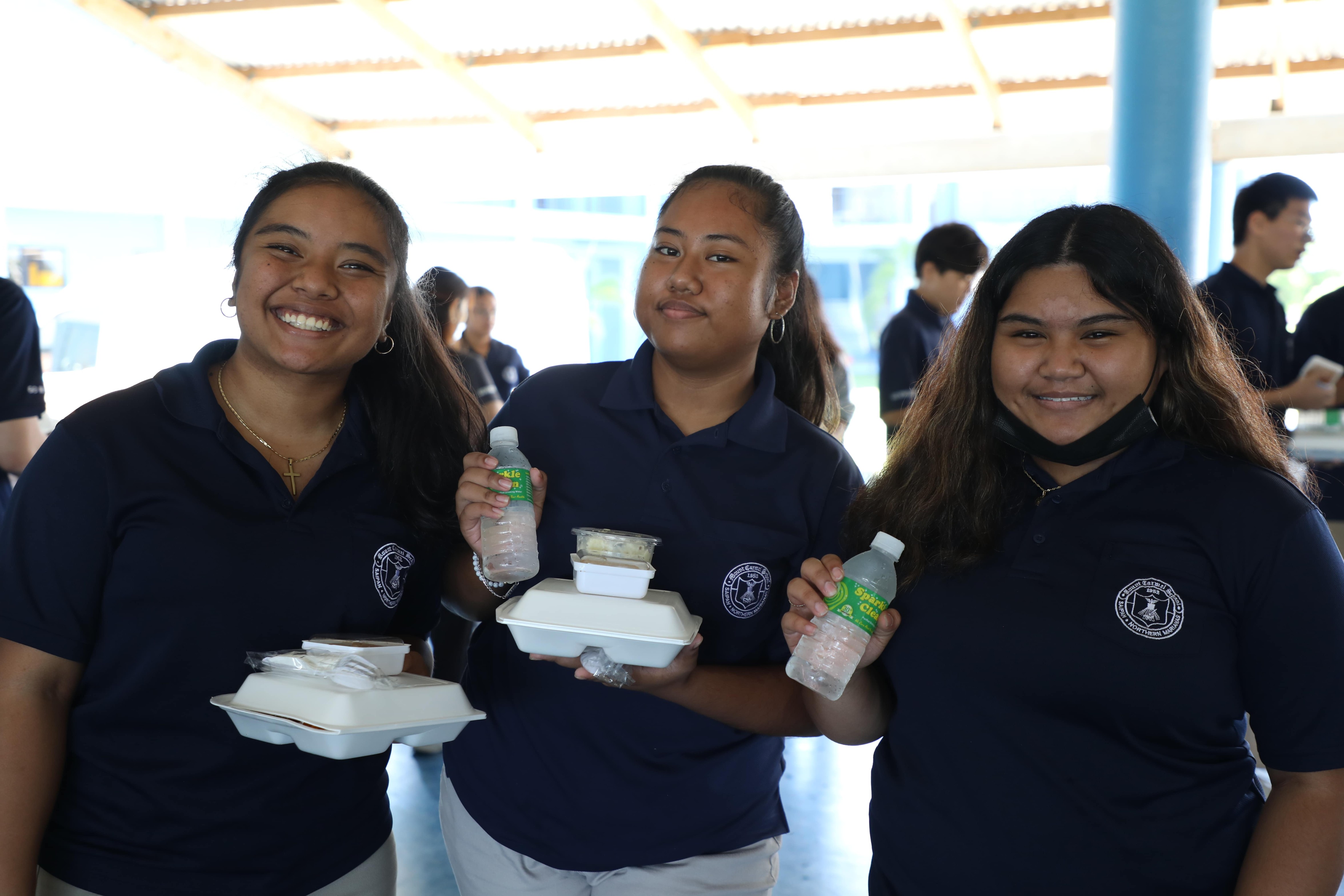 Mount Carmel School students were all smiles with the delicious food provided by the school and catered by Herman's Modern Bakery, LSG, and Kalayaan Inc. during the annual Thanksgiving Fiesta.