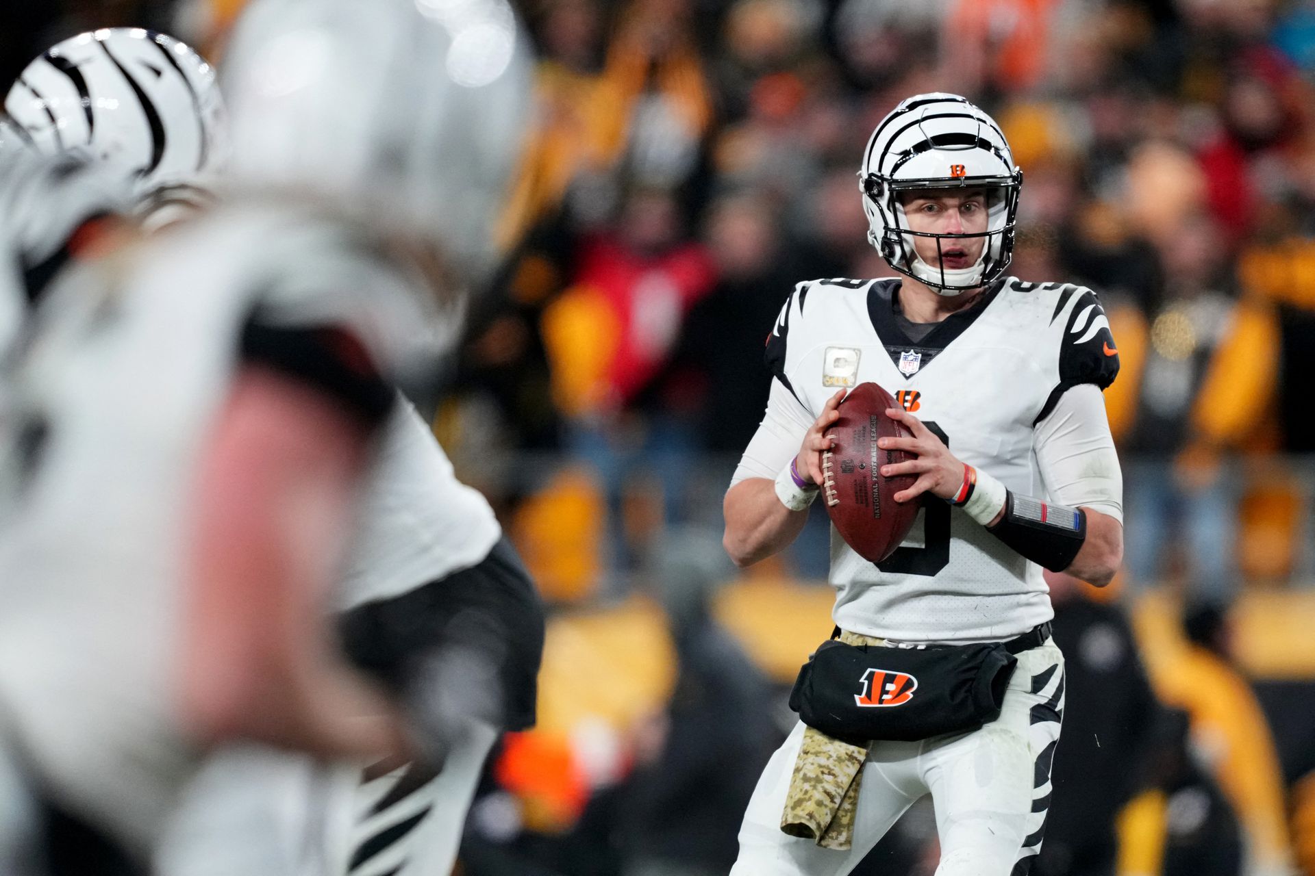 Cincinnati Bengals quarterback Joe Burrow (9) eyes Cincinnati Bengals wide receiver Trenton Irwin (16) as he drops back to pass in the third quarter against the Pittsburgh Steelers at Acrisure Stadium in Pittsburgh, Pennsylvania, Nov 20, 2022.