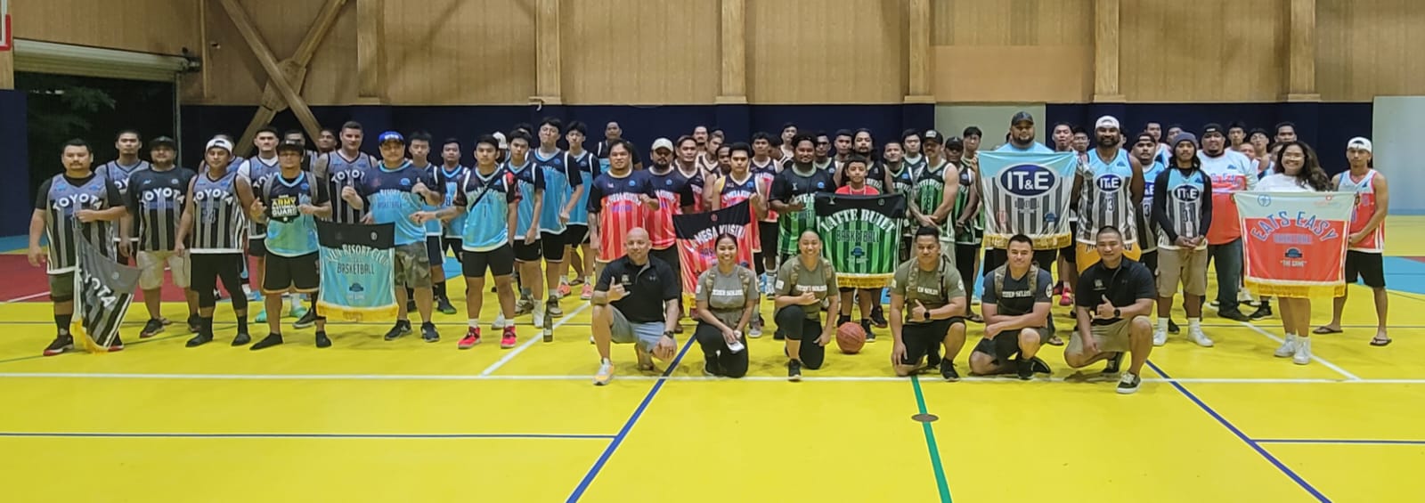 Guam Army National Guard members pose for a photo with the six participating teams of the MIBL Fantasy Draft basketball tournament Friday at the ACS gym.