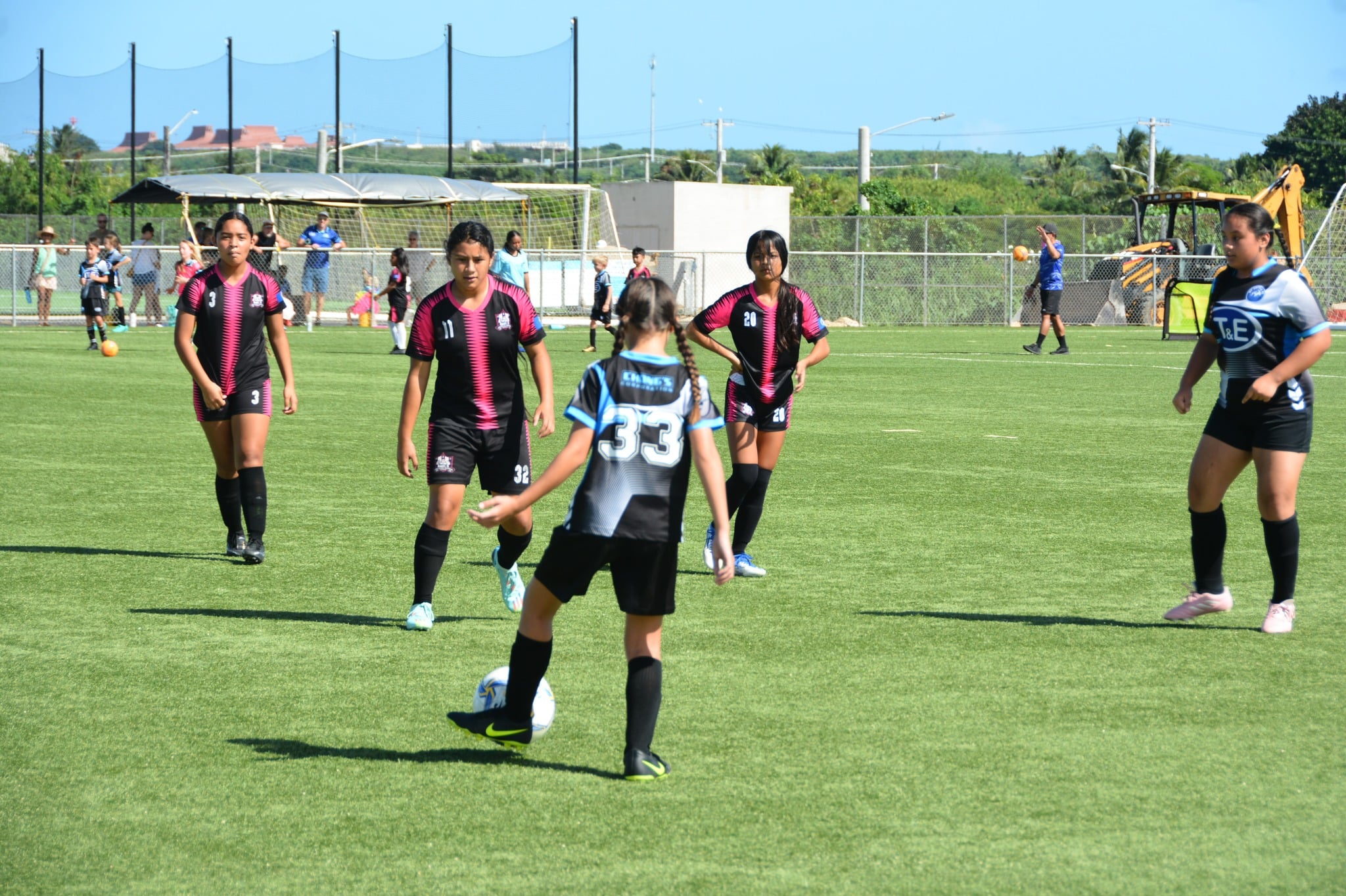 Southern United’s Rosie Saralu, 2nd left, looks on as she and her team mates close in on an MPU possession during the U13 girls division championship game of the TakeCare Youth Soccer League on Saturday at the NMI Soccer Training Center.