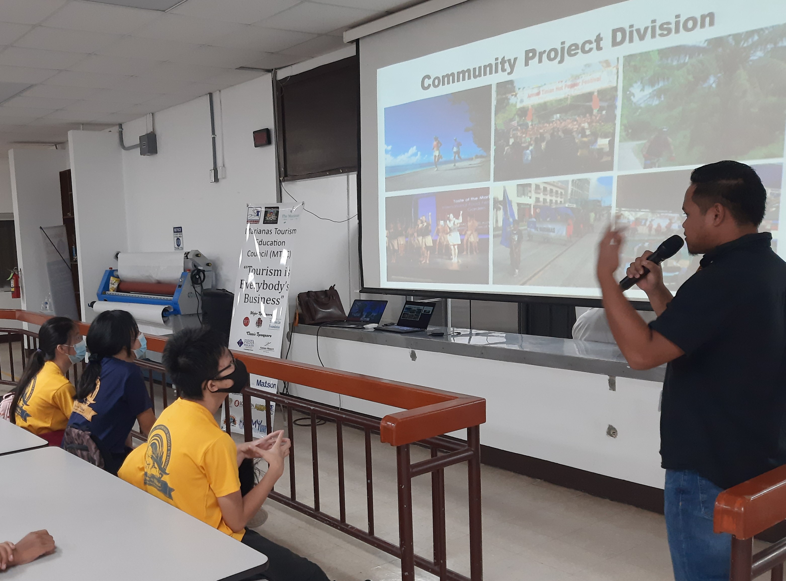Students at Admiral Herbert G. Hopwood Middle School in Saipan learn about the programs of  the Marianas Visitors Authority  from MVA Community Projects Specialist Jack Aranda on Nov. 21, 2022, as part of the annual school presentations of MVA and the Marianas Tourism Education Council.