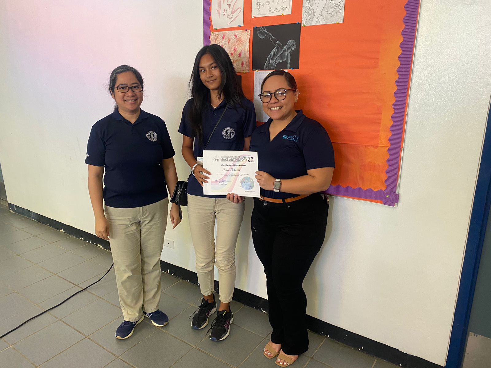 Mount Carmel School's Tricia Palacios was all smiles with her principal Filmah Buenaflor after being presented with her award and cash prize for winning the Pacifica Art Contest Digital Category.  Also in the photo is Pacifica Insurance's Dionne Camacho.