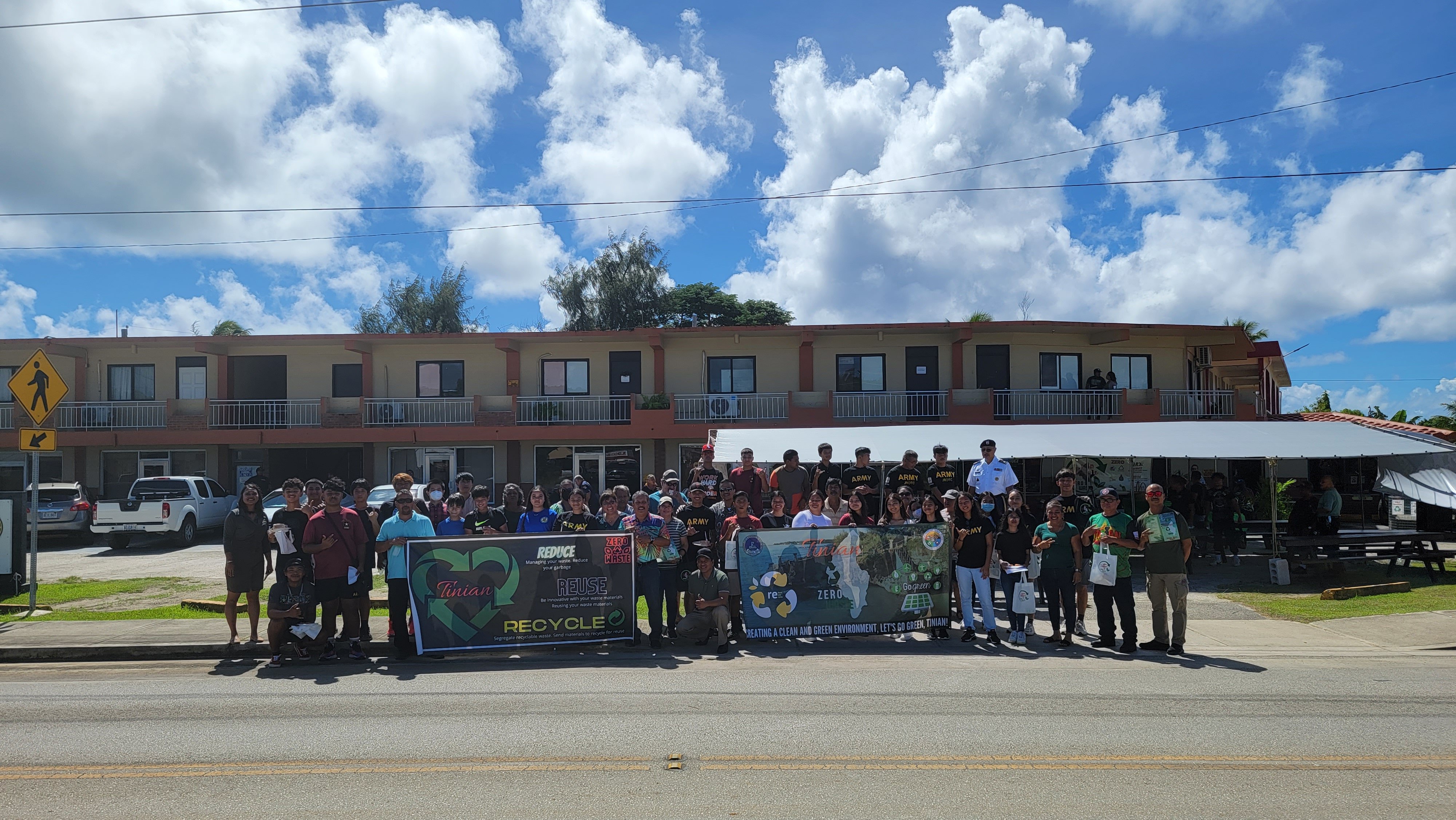 Office of the Mayor of Tinian and Aguiguan staff, Tinian leadership, other dignitaries, and Tinian community members pose for a group photo after a CNMI Recycles Week ceremony held on Nov. 15 on Tinian.
