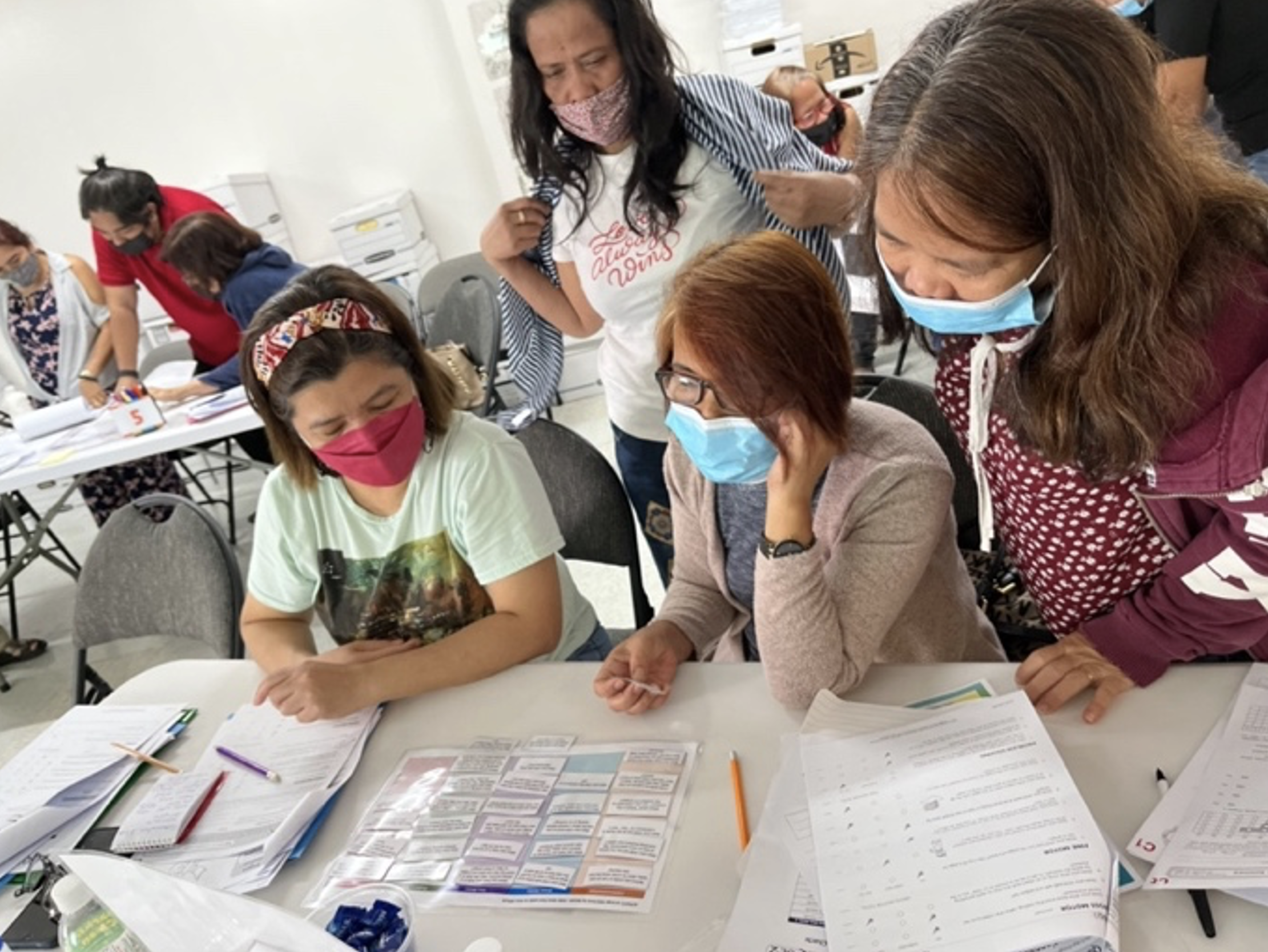 Child care providers participate in a training on “Introduction to Ages and Stages Questionnaires – 3rd Edition” at Evergreen Learning Training Center in Chalan Kanoa.