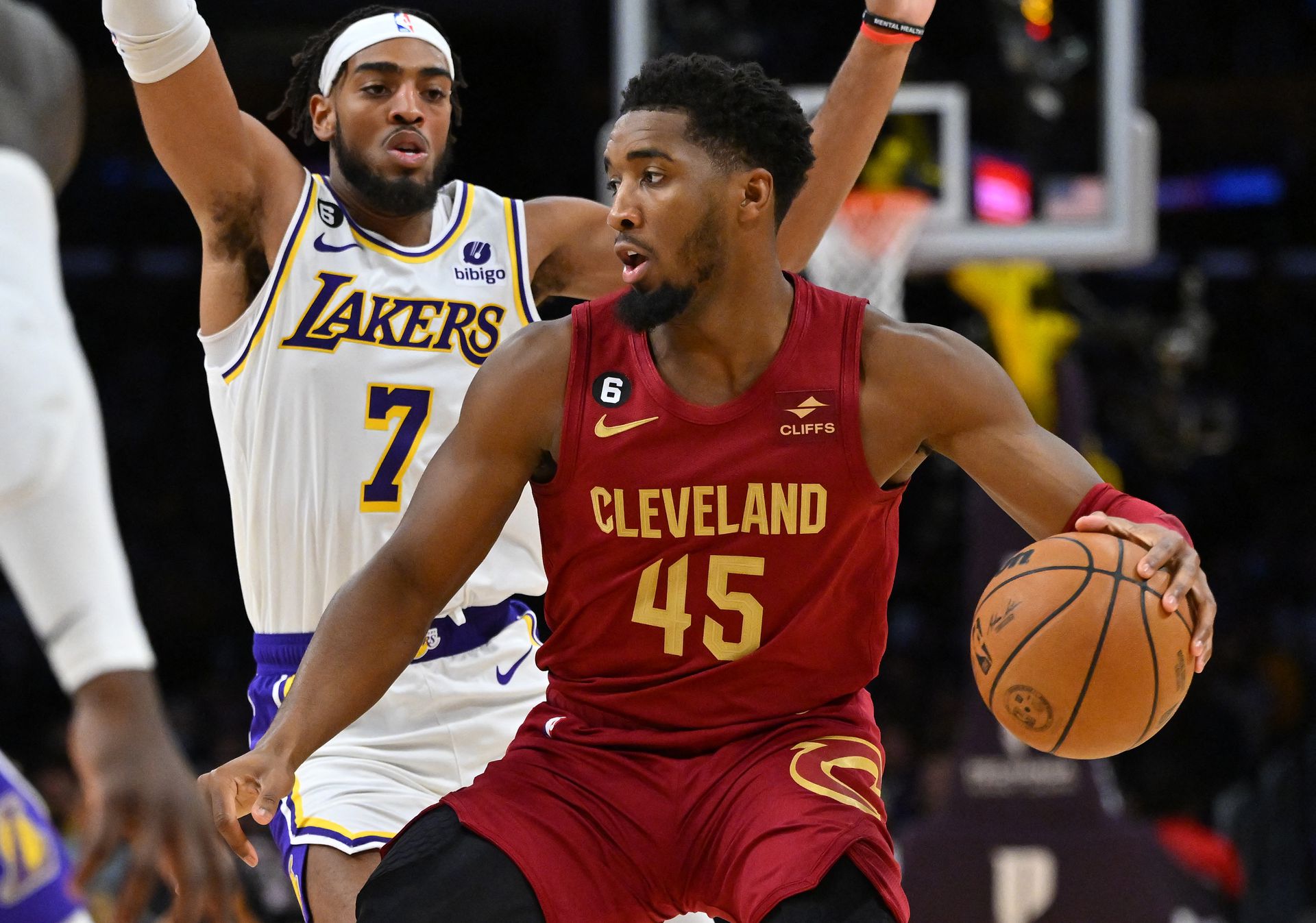 Los Angeles Lakers forward Troy Brown Jr. (7) guards Cleveland Cavaliers guard Donovan Mitchell (45) as he drives to the basket in the first half at Crypto.com Arena in Los Angeles, California, Nov. 6, 2022.