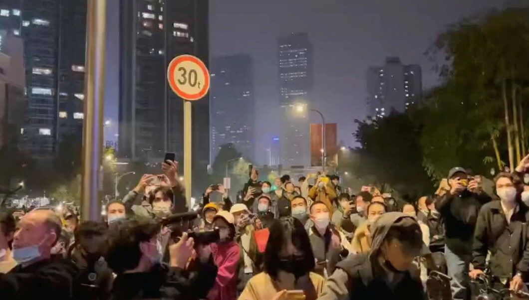 Protesters chant slogans in support of freedom of speech and the press, amid broader nationwide unrest due to Covid-19 lockdown policies, in Chengdu, China in this still image obtained from undated social media video released Nov. 27, 2022.