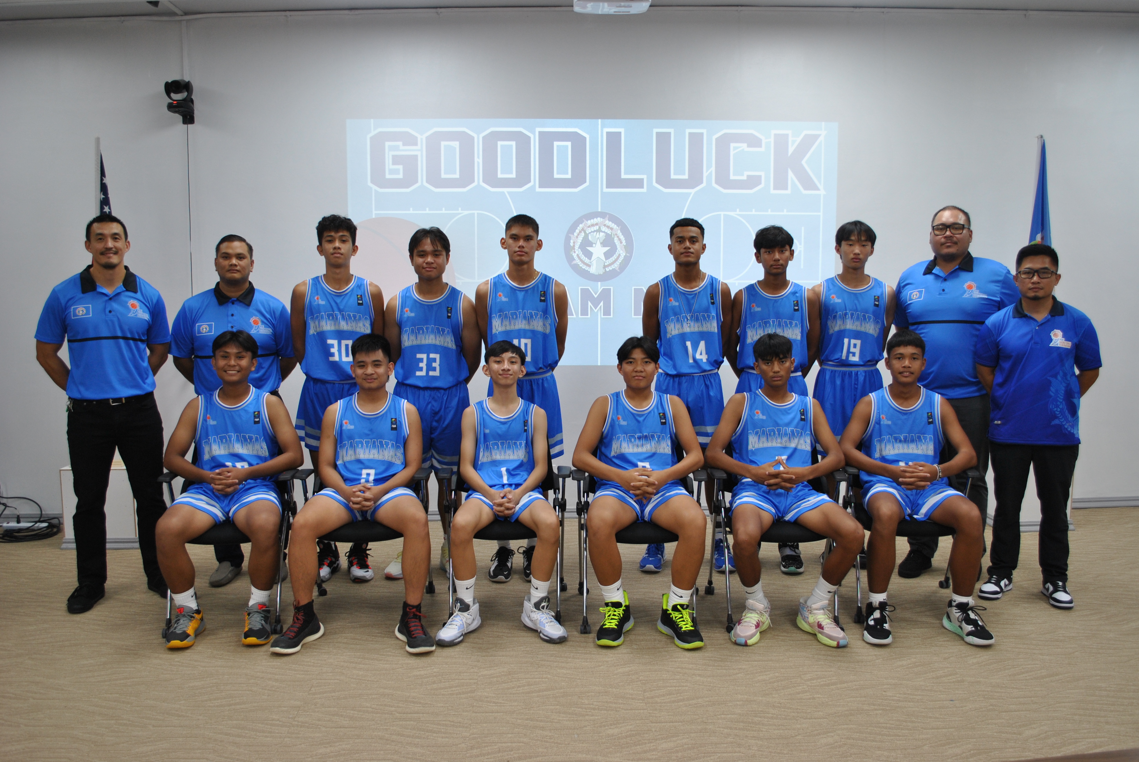 The U15 Boys Jr. National Team members pose for a photo with NMI Basketball Federation President James Lee, Head Coach Jake Maratita, Assistant Coach Jose Tudela and Team Manager Mike Mercado during a sendoff ceremony on Tuesday at the Ada gym. The boys will compete in the FIBA U15 Oceania Championship on Guam  from Nov. 21 to 26.