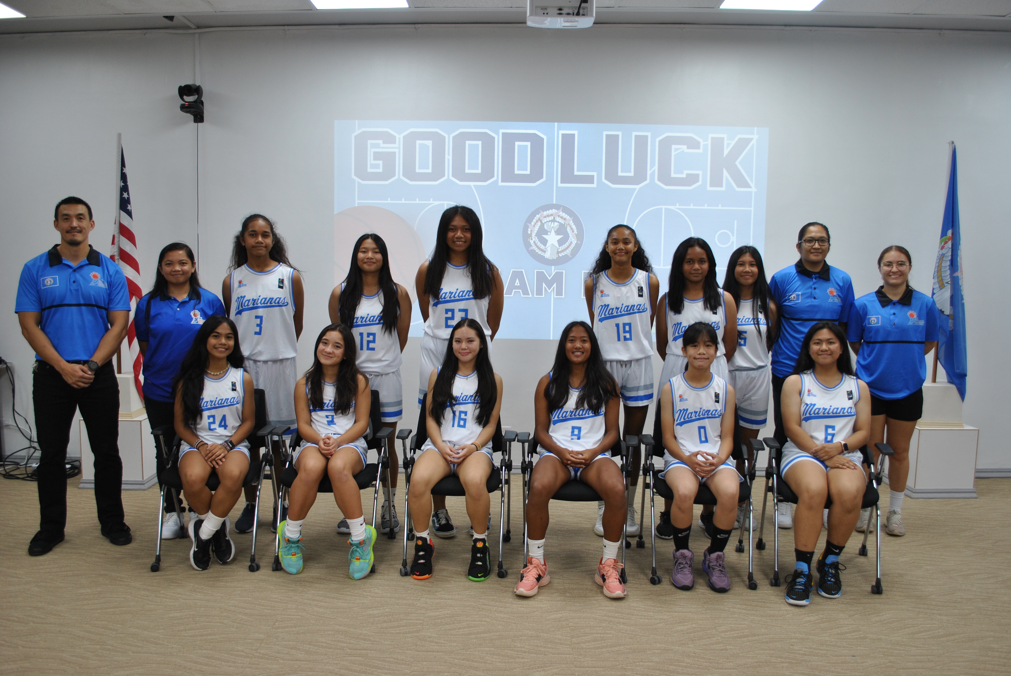 The U15 Girls Jr. National Team members pose for a photo with NMI Basketball Federation President James Lee, Head Coach Marlene Lumabi, Assistant Coach Madeleine Alegre and Team Manager Richelle Kautz during a sendoff ceremony on Tuesday at the Ada gym. The girls will compete in the FIBA U15 Oceania Championship on Guam from Nov. 21 to 26.
