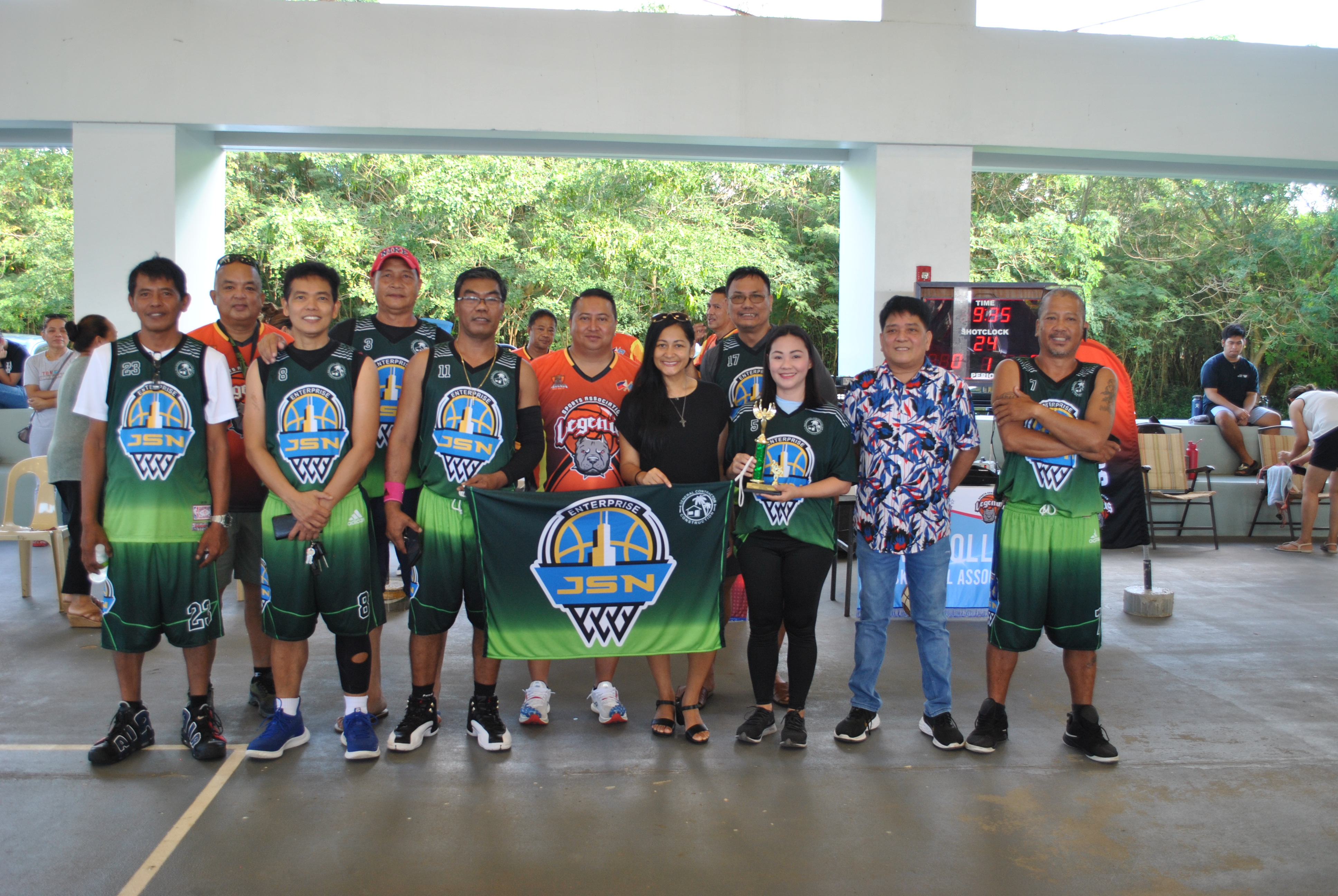 Team JSN and their muse Jane Olivario pose for a photo with Gov. Ralph DLG Torres and first lady Diann T. Torres during the opening ceremony of the Legends Sports Association Invitational Basketball League  at the Koblerville gym on Sunday. Jane Olivario was named the Best Muse in the masters division.